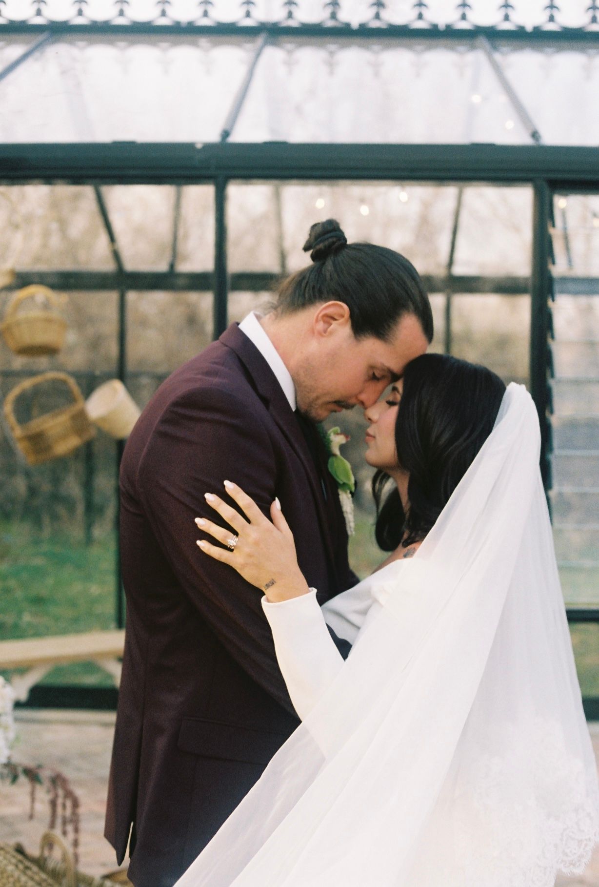 A romantic wedding couple shares an intimate moment together in a series of candid black and white photographs.