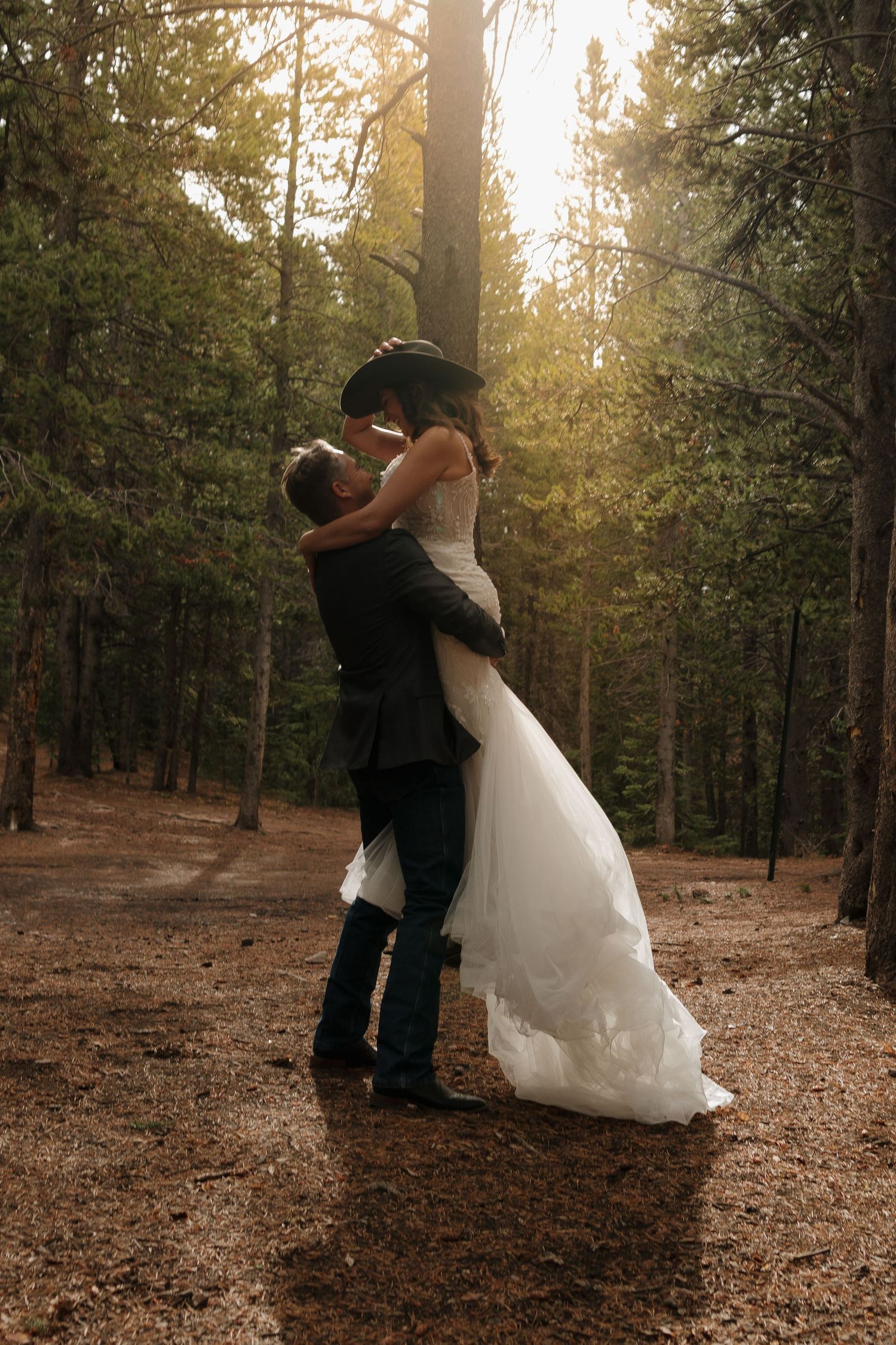 A romantic dance sequence in a sunlit forest with golden light streaming through the trees.