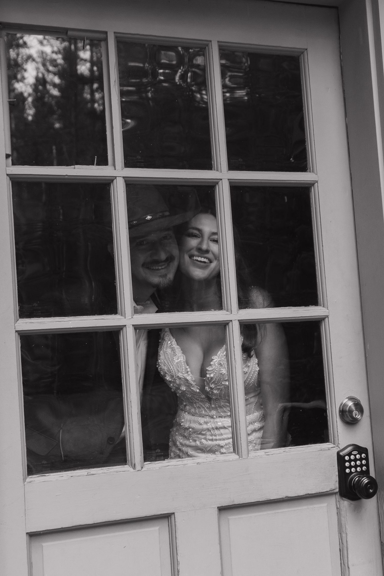 A joyful moment captured through a vintage window pane.