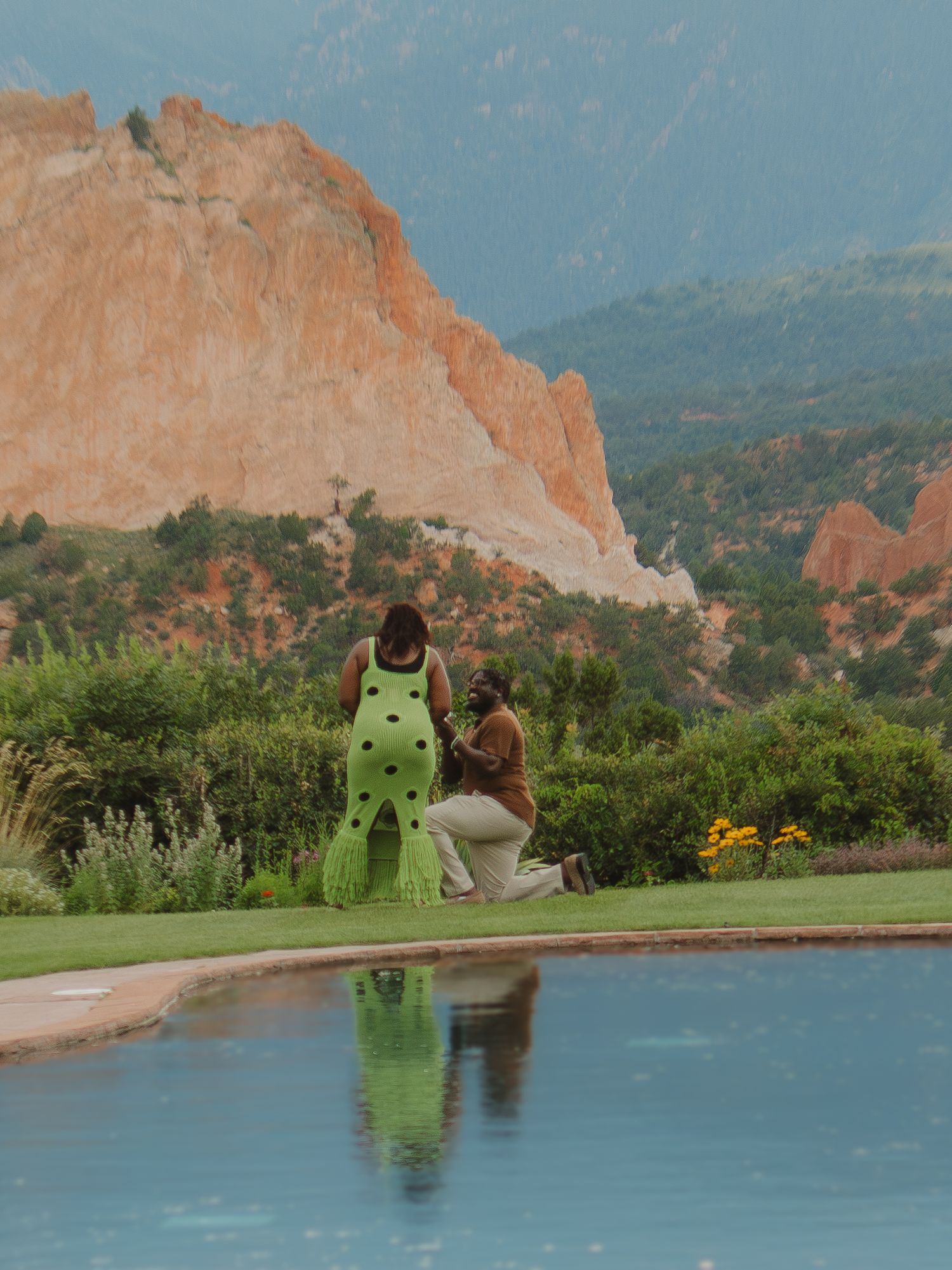 A scenic panoramic view of red rock formations and golf courses at Garden of the Gods in Colorado Springs.