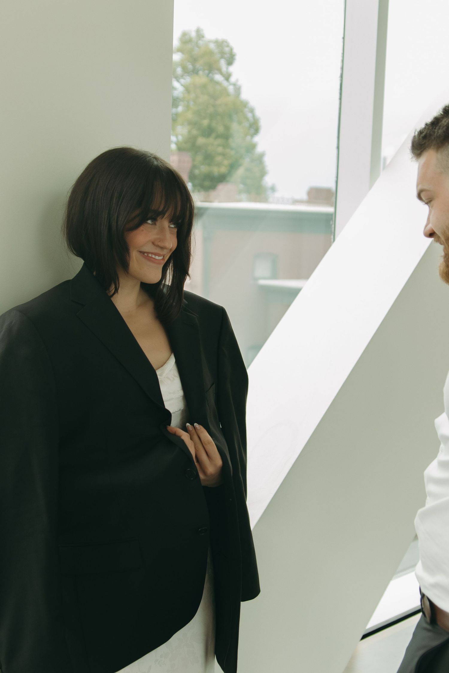 Couple sharing intimate moment in bright modern space.