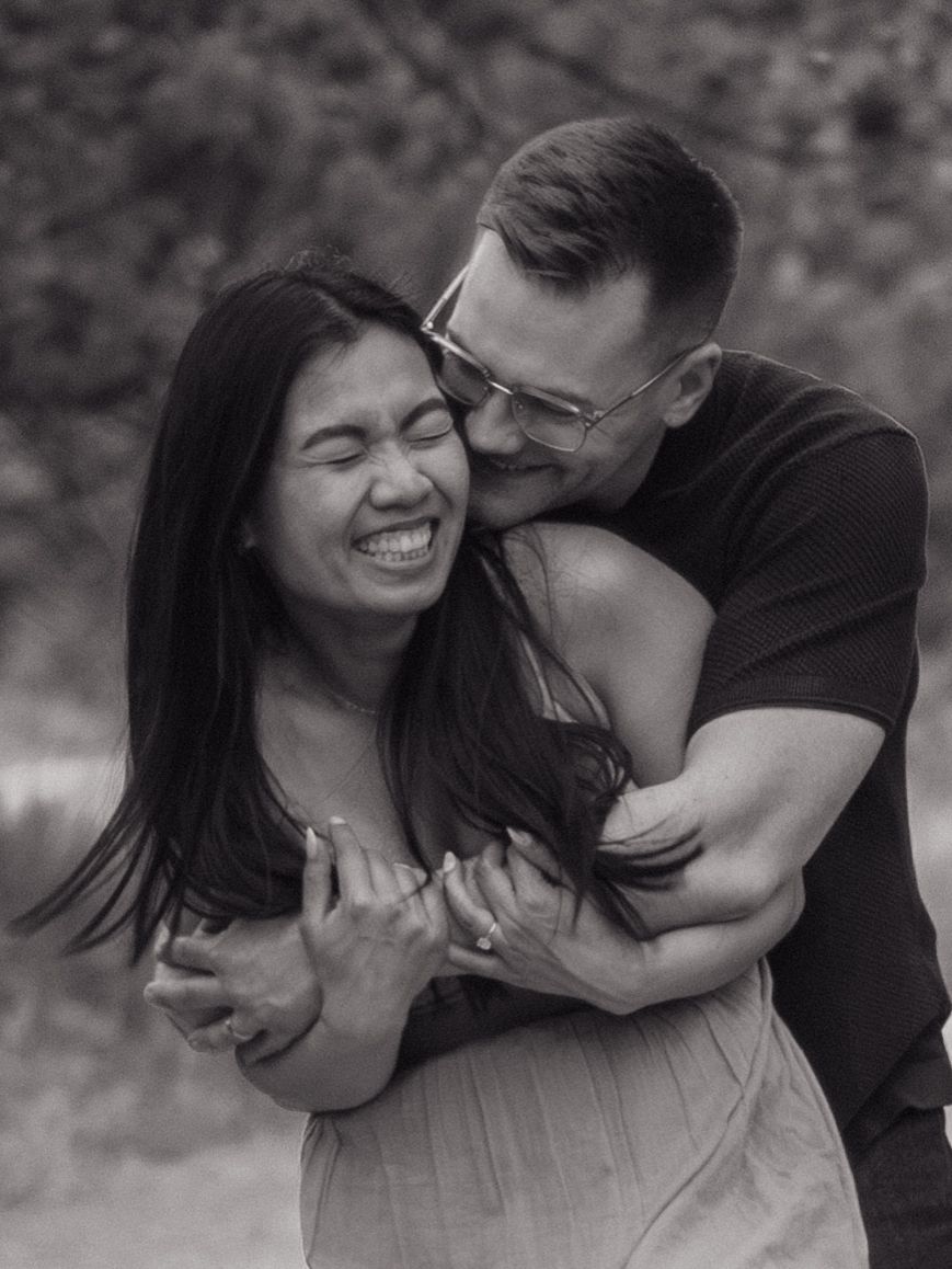 A series of candid black and white photos showing joyful moments between two people.