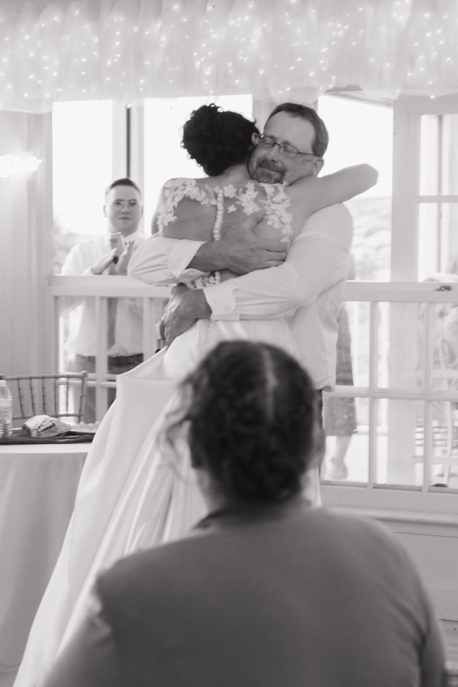 Black and white photos of couples dancing at a wedding reception.