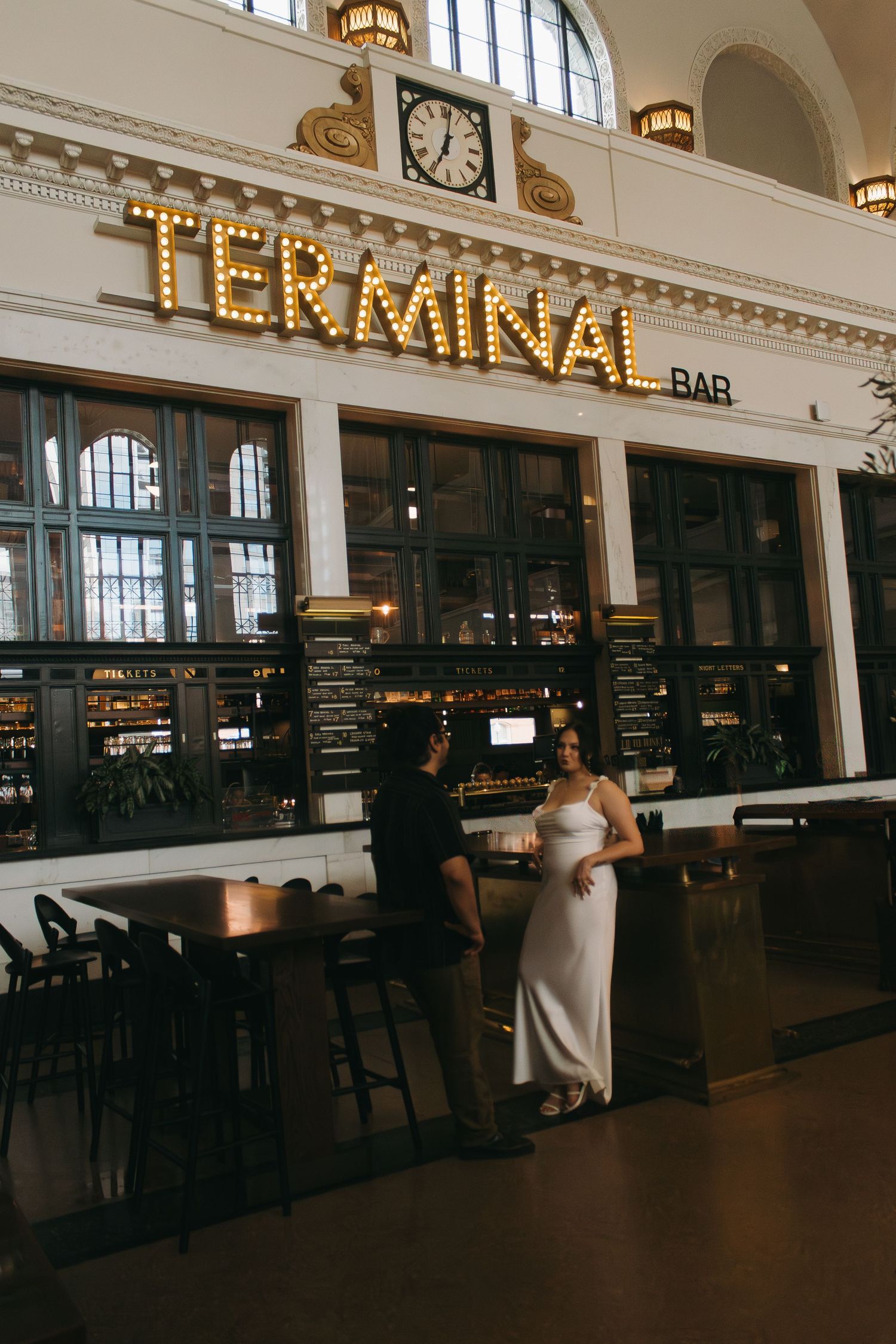 An elegant venue with illuminated Terminal Bar signage and classic architectural details.