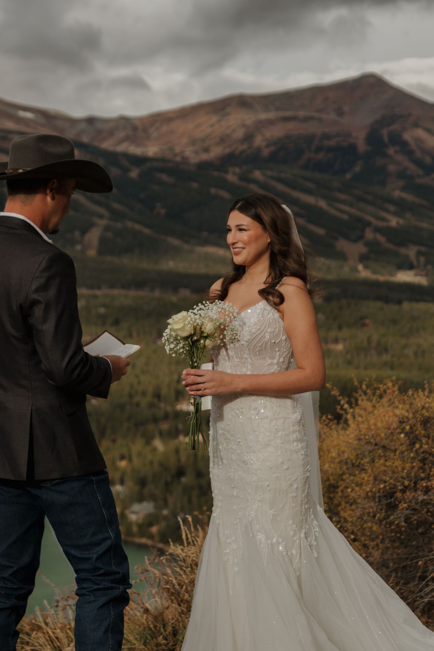 Mountain wedding ceremony with stunning fall landscape views.