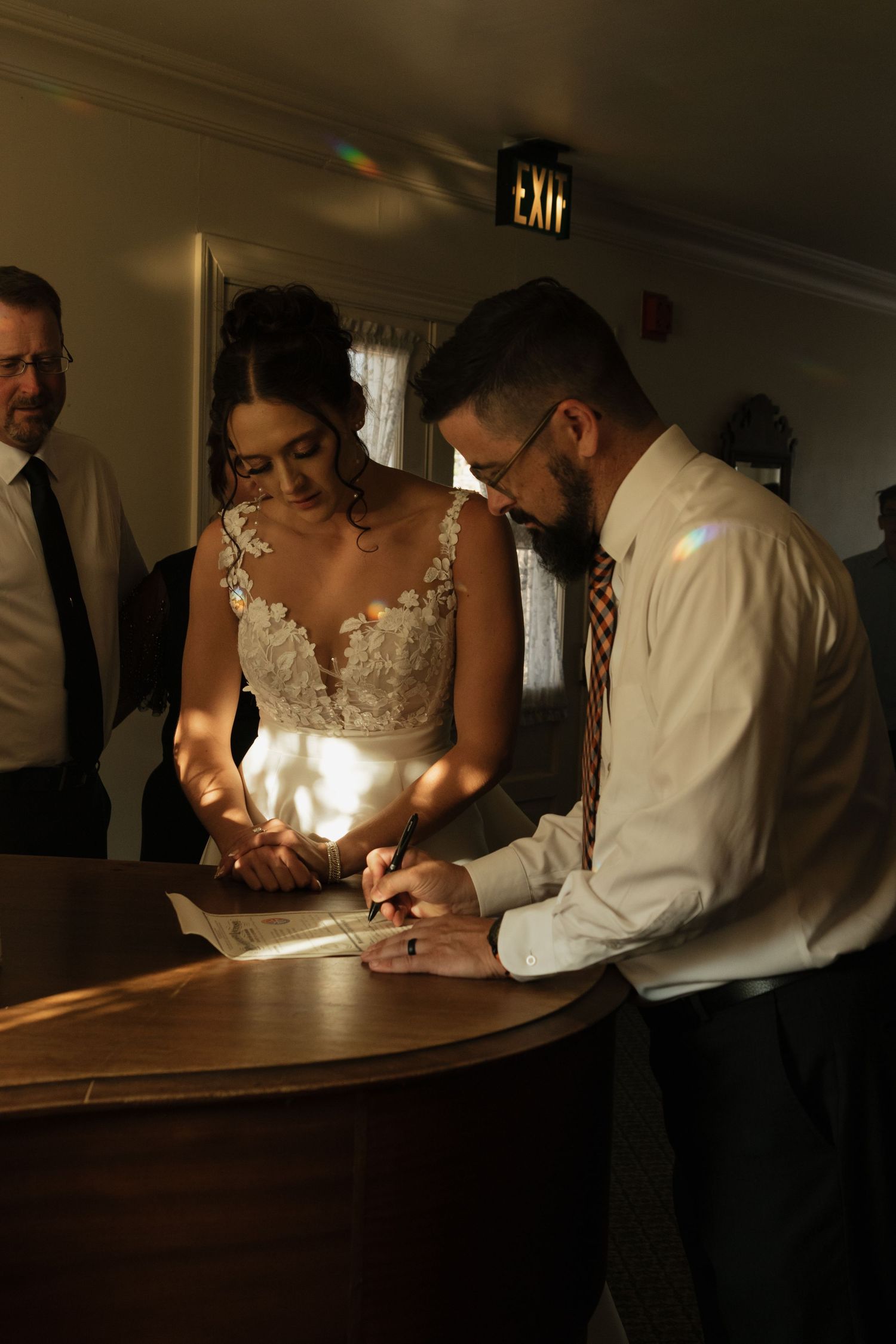 Intimate moment captured in low light at a wedding reception.