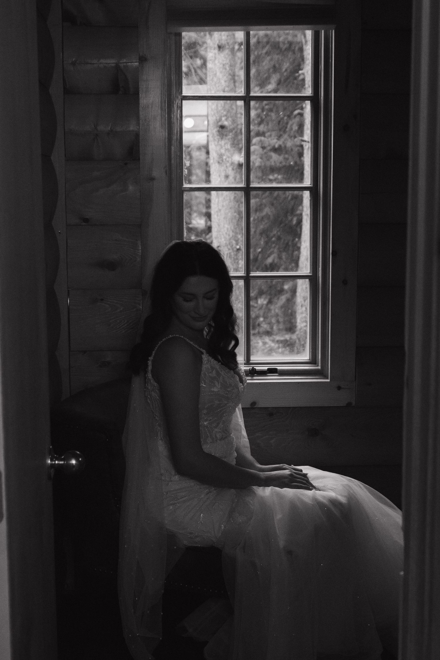 Artistic black and white window silhouette in a rustic interior.