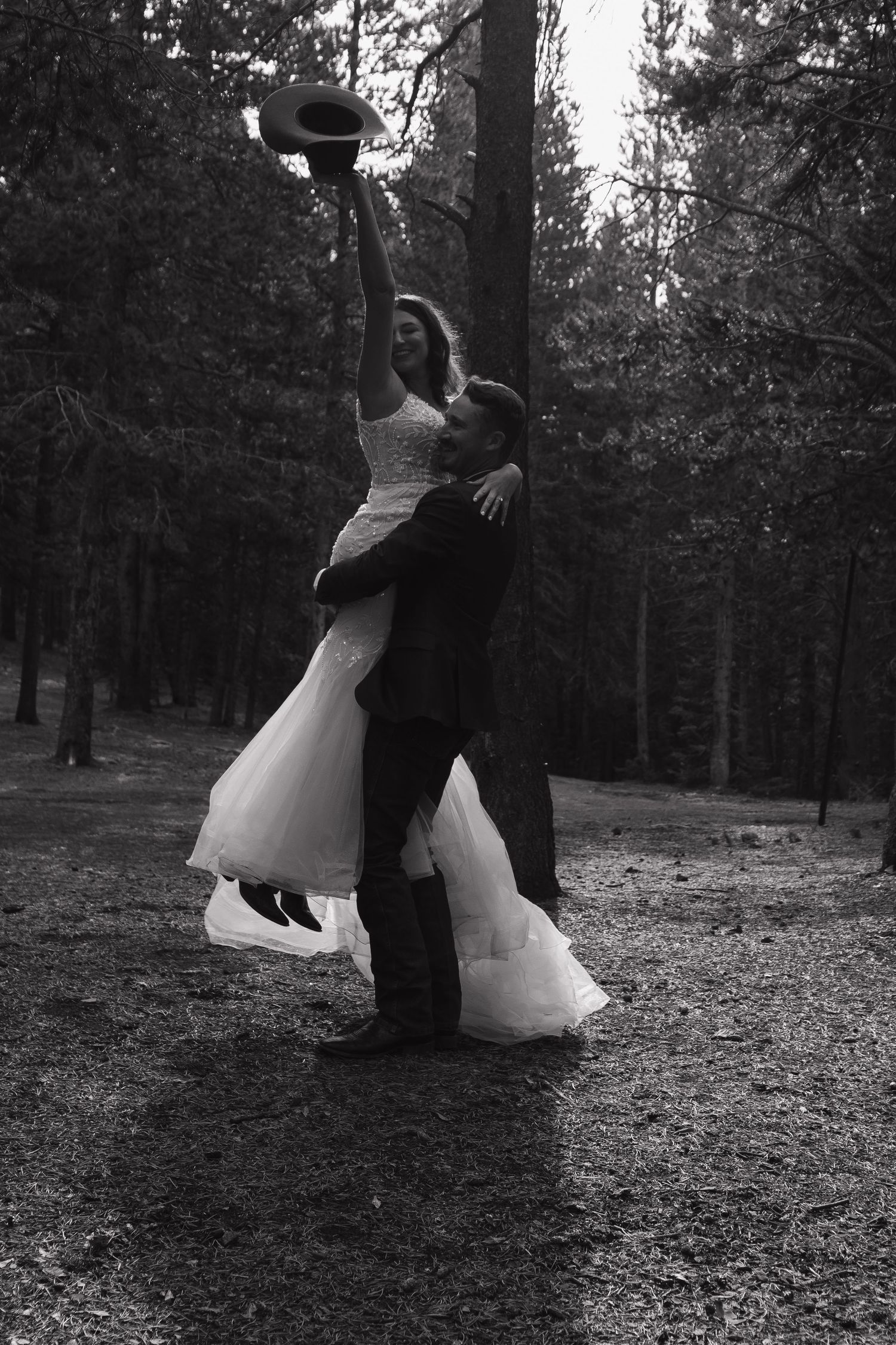 A romantic black and white dance sequence in a forest setting.