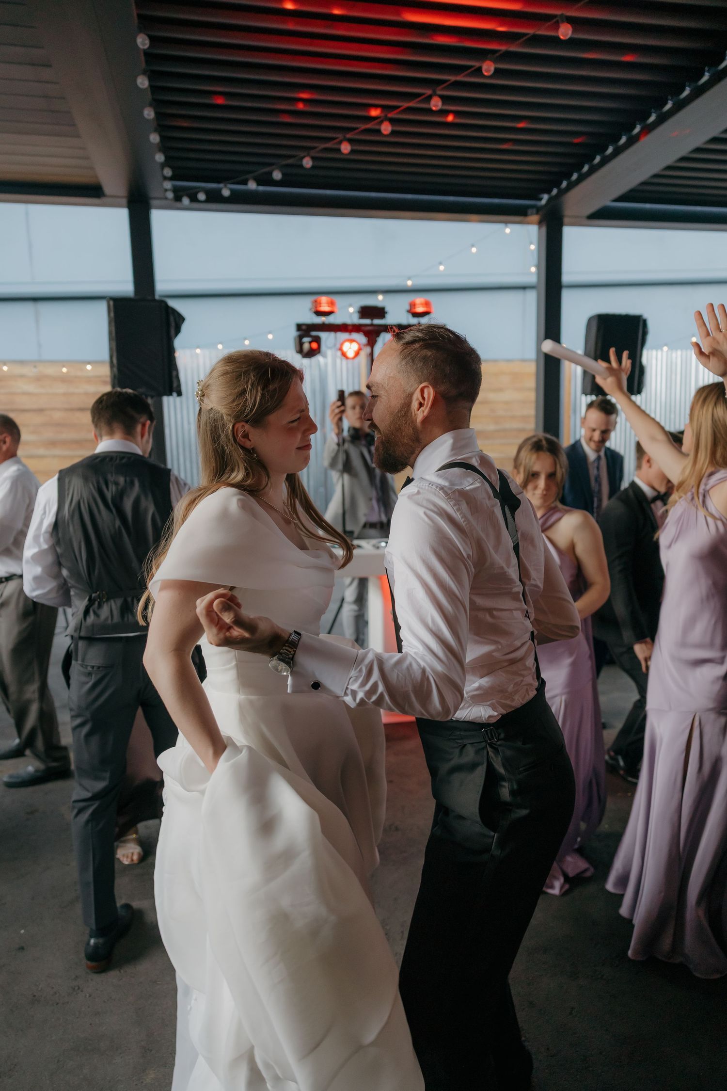 Bride and groom share a romantic first dance at their wedding reception.