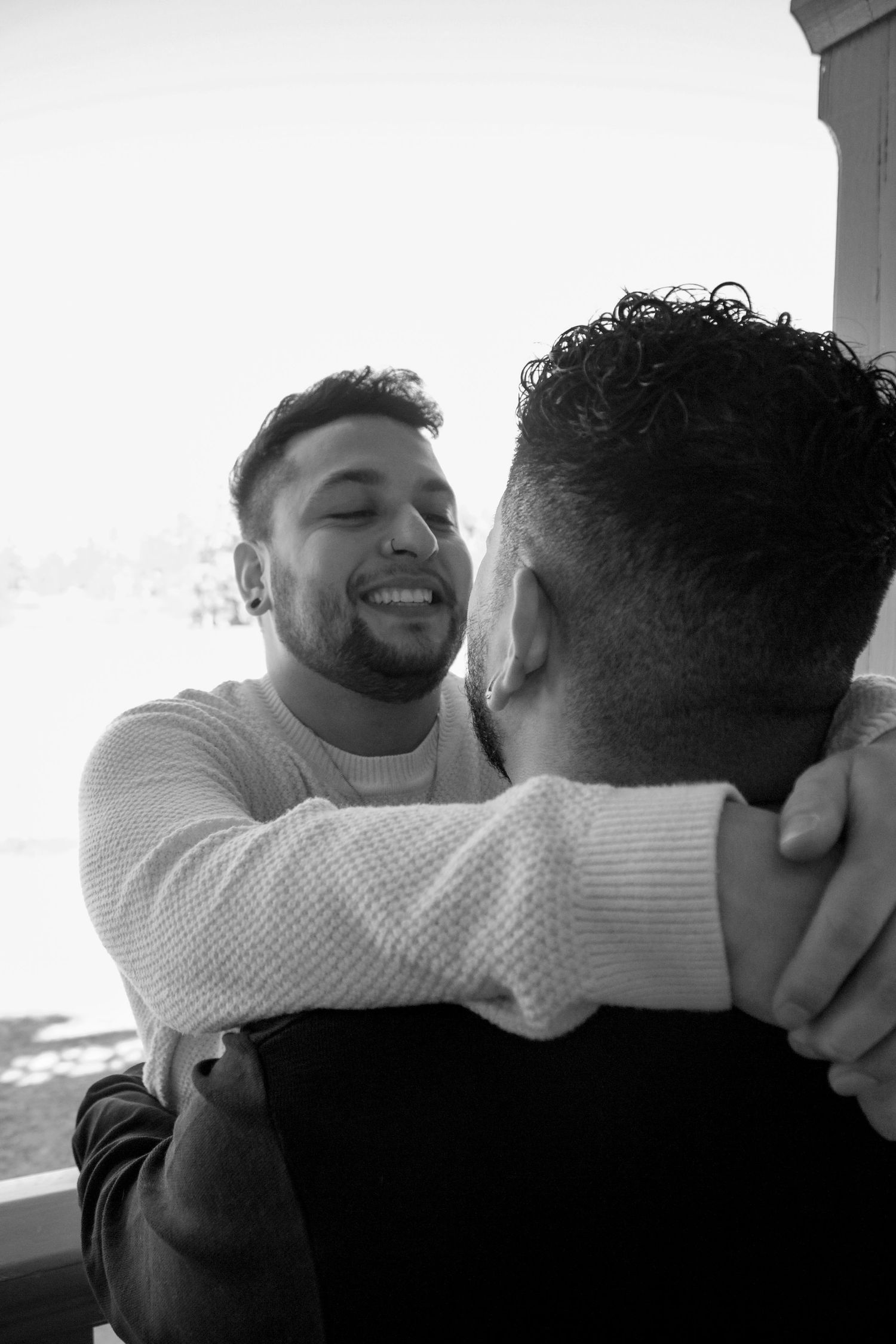 Black and white candid shot showing joyful expressions.