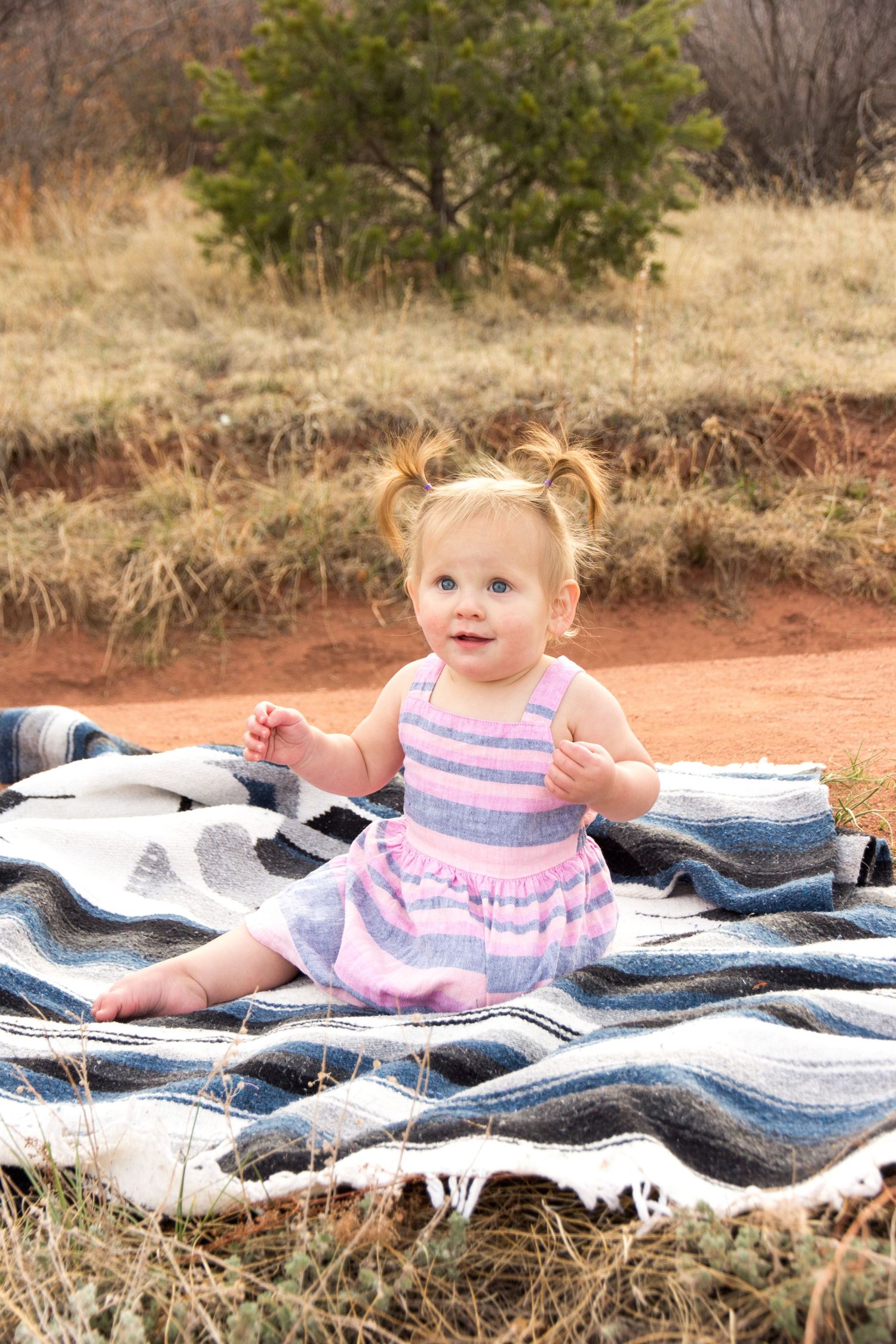 Lifestyle baby portrait on soft blanket outdoors by Broomfield Colorado family photographer Cassandra Jene