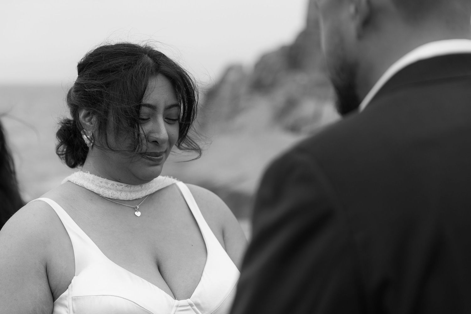 A collection of wedding photos showing tender moments between a couple in white formal attire.