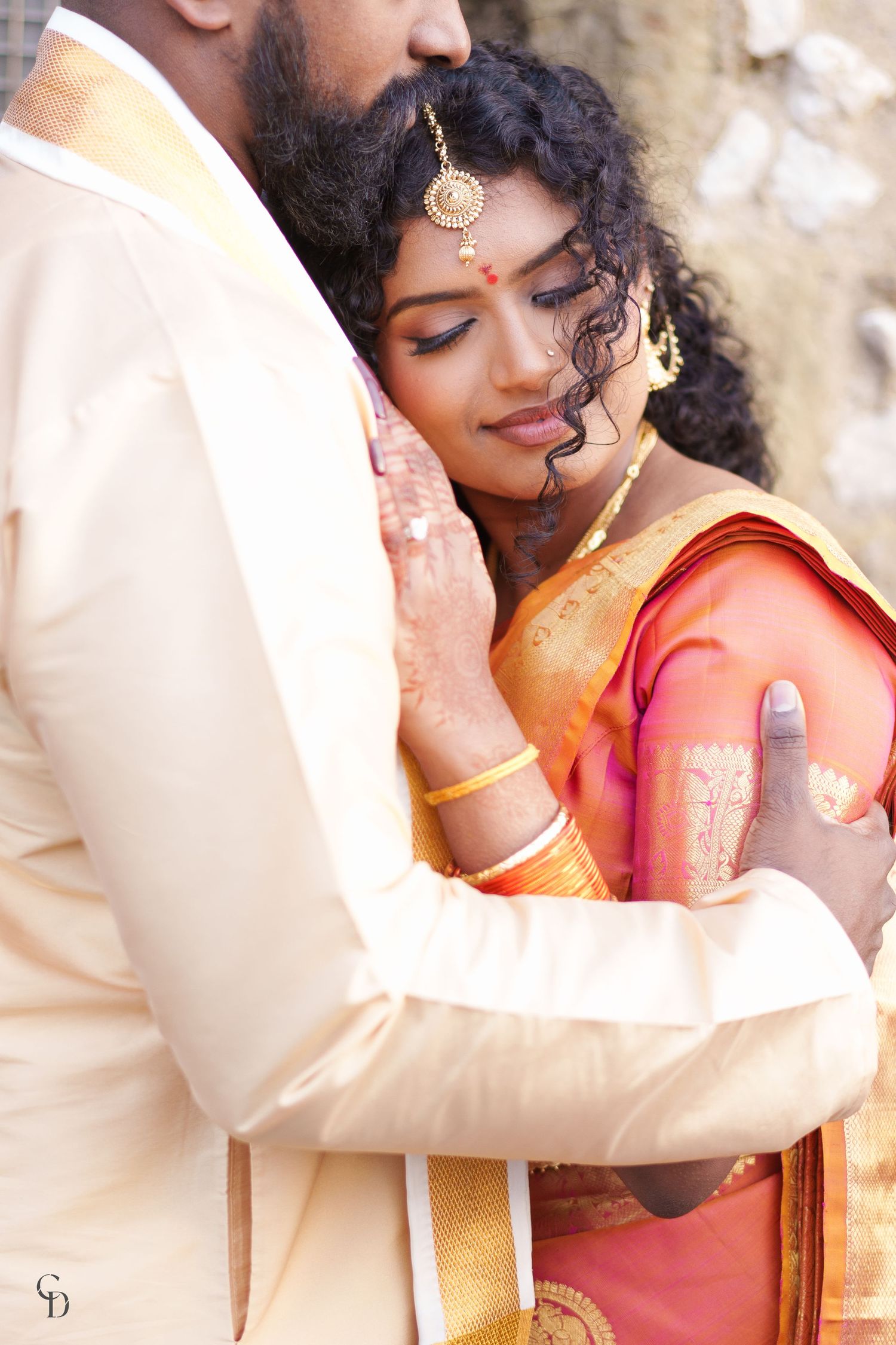 Intimate wedding portrait showcasing traditional South Indian bridal jewelry and attire.