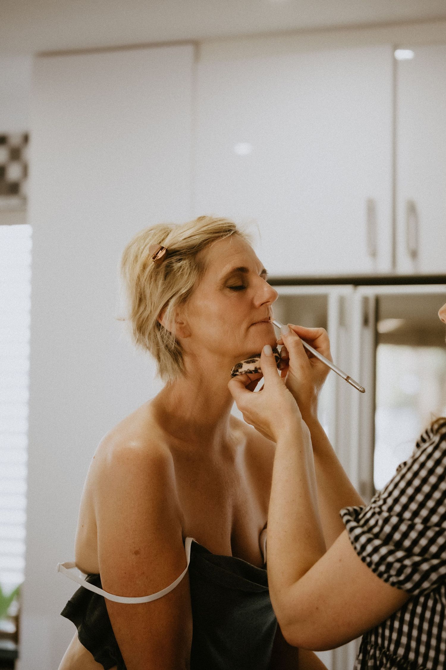 Gerda getting her make up done for her wedding