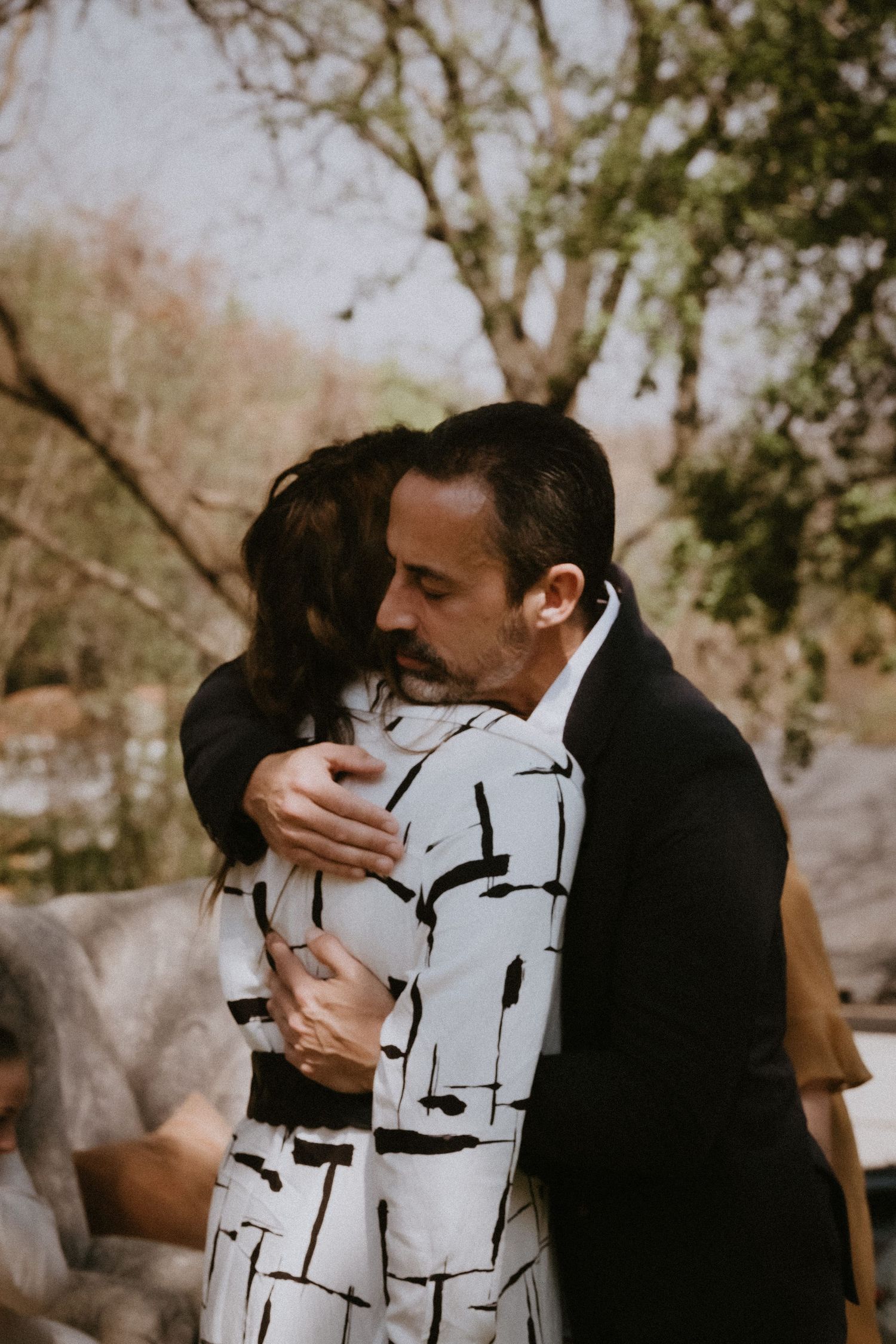 Wedding guests hugging