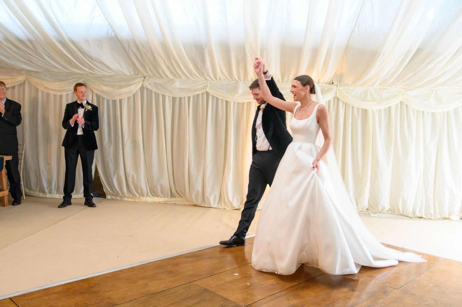 Bride & groom's grand entrance to their wedding breakfast in a barn marquee, Derbyshire farm – SimplyGreatShots Photography