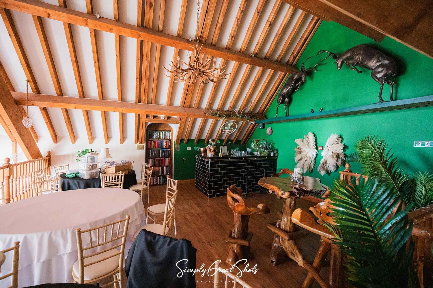 Winters Tale Country Barn Wedding Photographer captures the Adults Only Antlers Cocktail Bar in the eves of the roof at the stunning barn