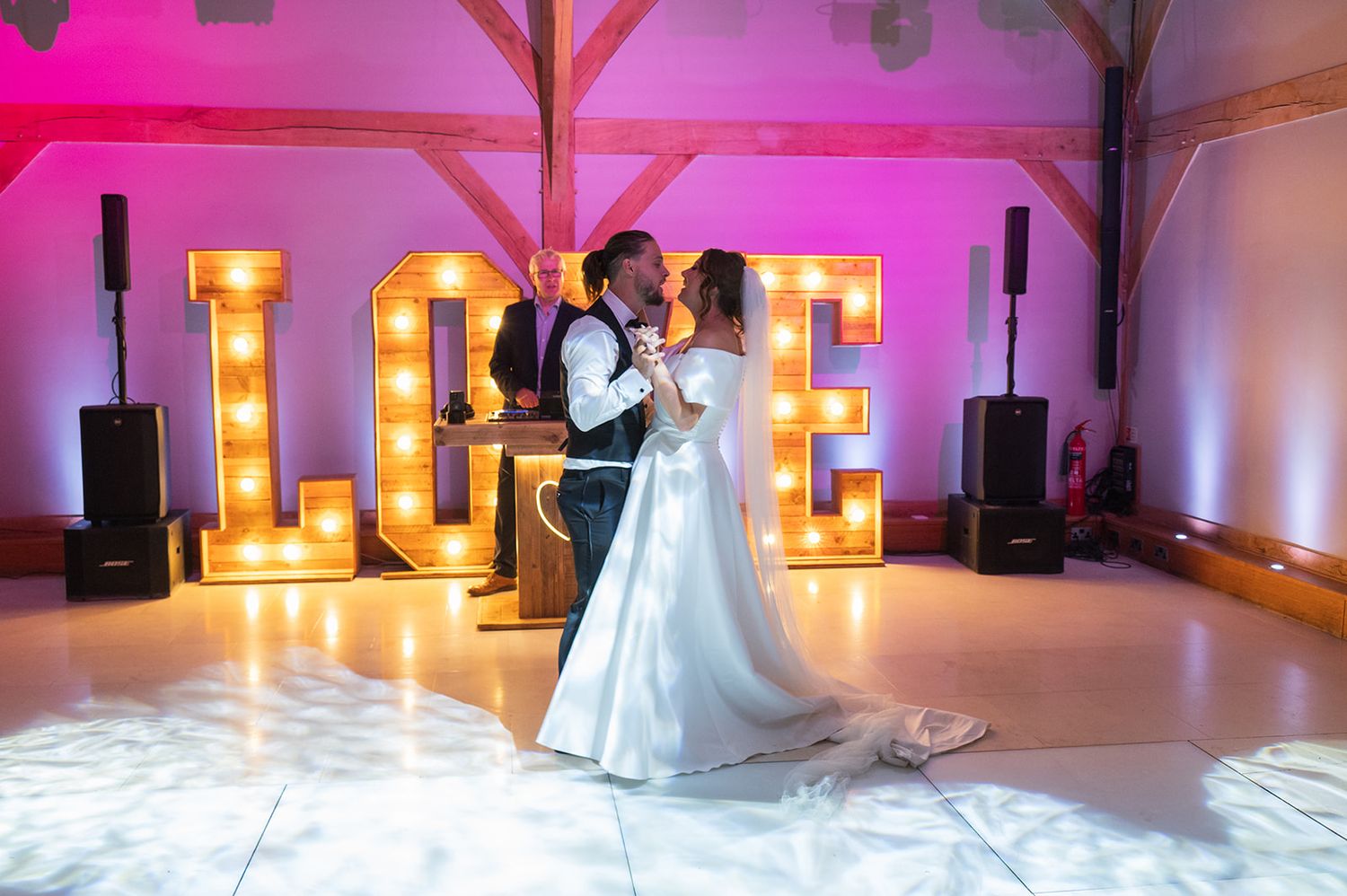 A bride and groom during their first dance at Redhouse Barn Wedding Venue.