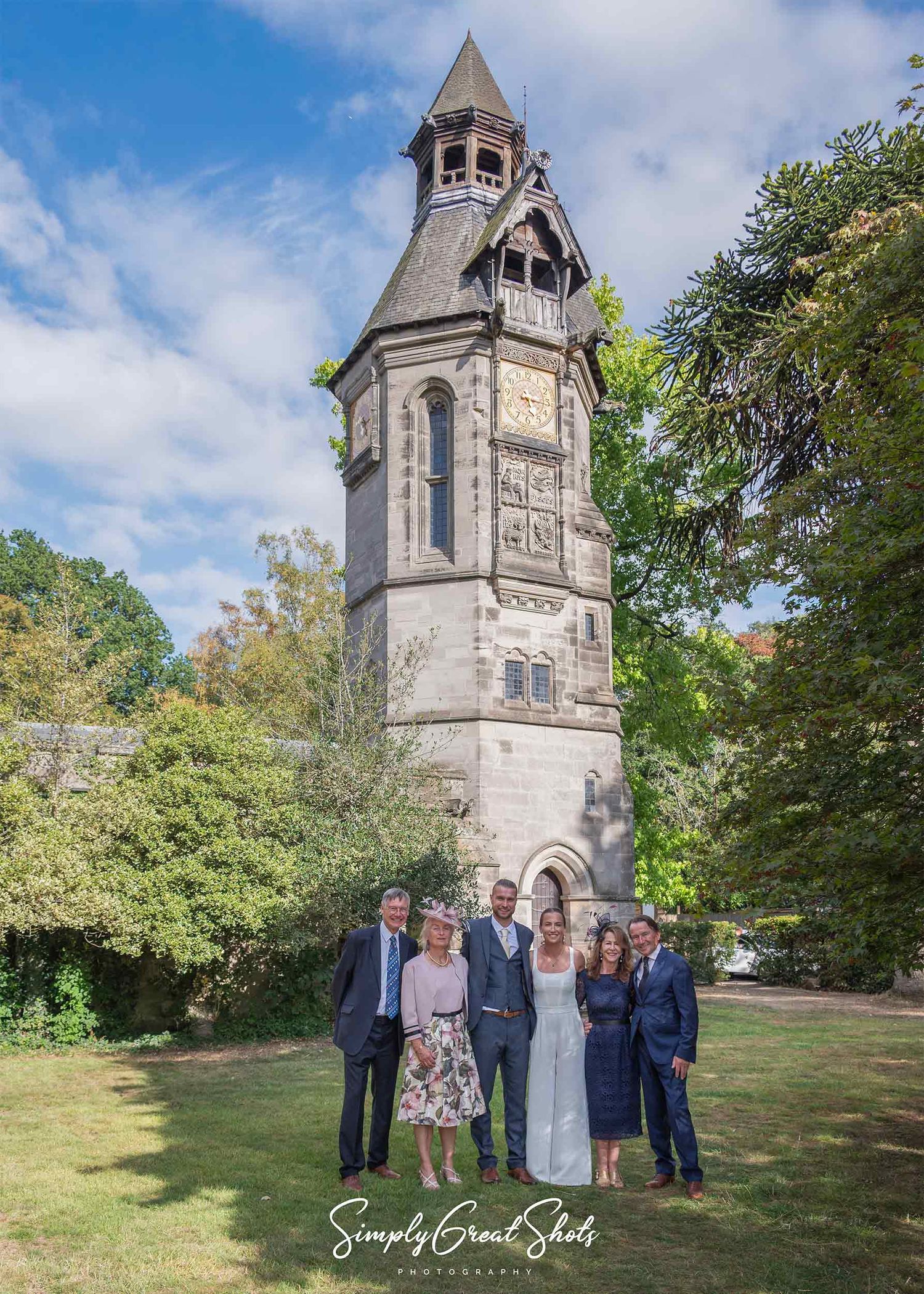 Hampton Manor wedding photographer captures a wedding party in front of the clock tower