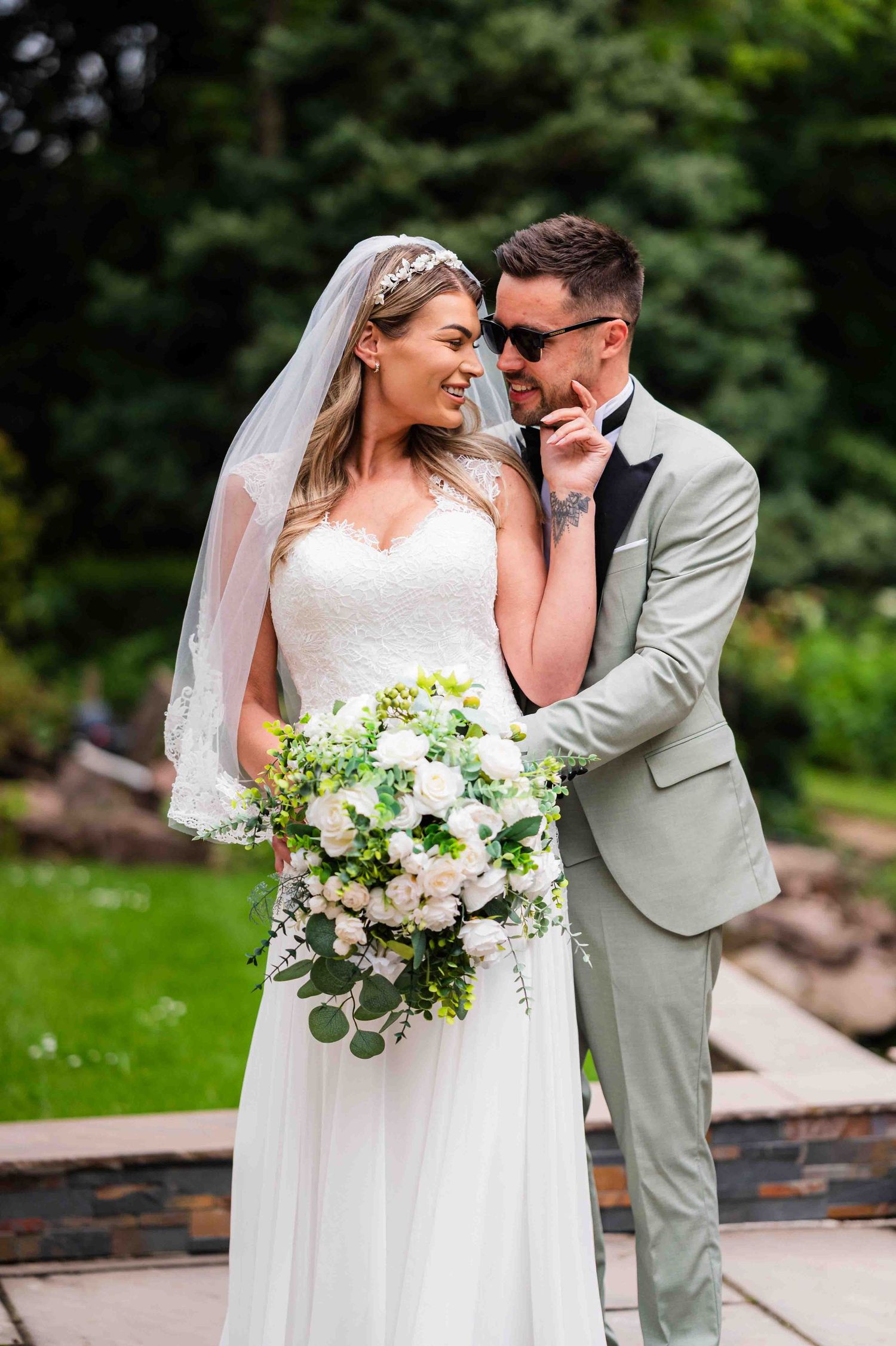 A shared tender moment between a bride and groom