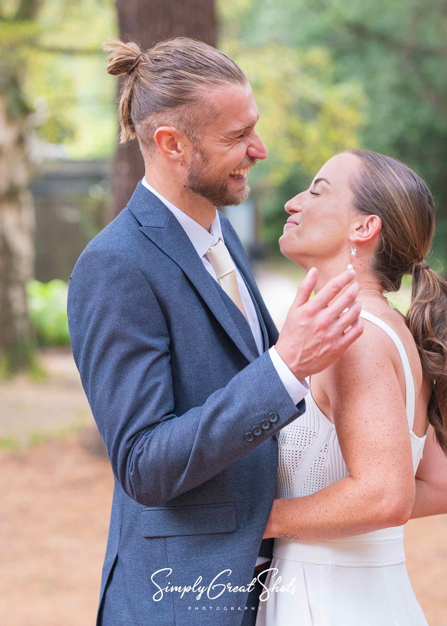 Hampton Manor wedding photographer captures husband and wife smiling in ancient woodlands