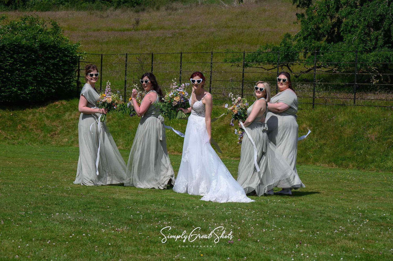 Ansty Hall wedding photographer capturing bride and bridesmaids in Georgian estate landscaped gardens