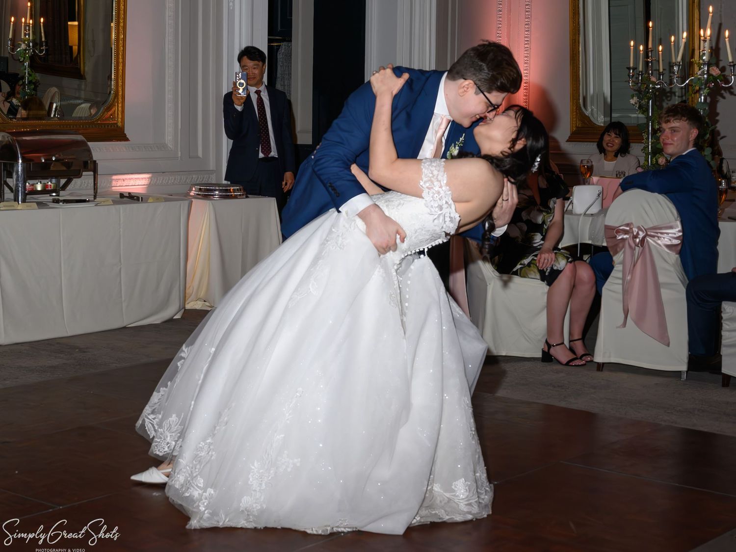 SimplyGreatShots capturing groom Mark dipping bride Minky during their first dance in The Cloisters at Coombe Abbey.