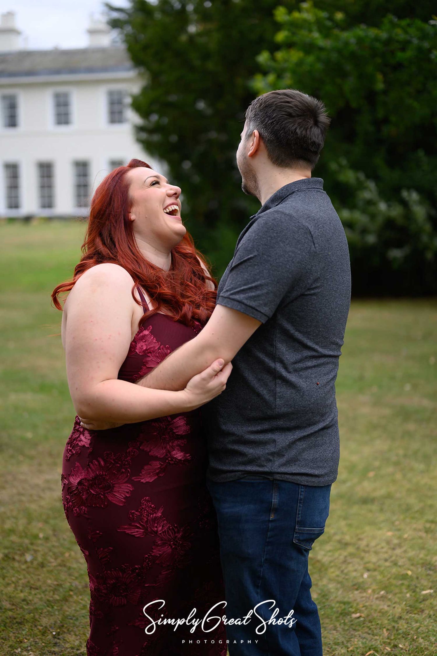 Eastwood Hall wedding photographer captures an engaged couple laughing at a pre-wedding photoshoot at their wedding venue.