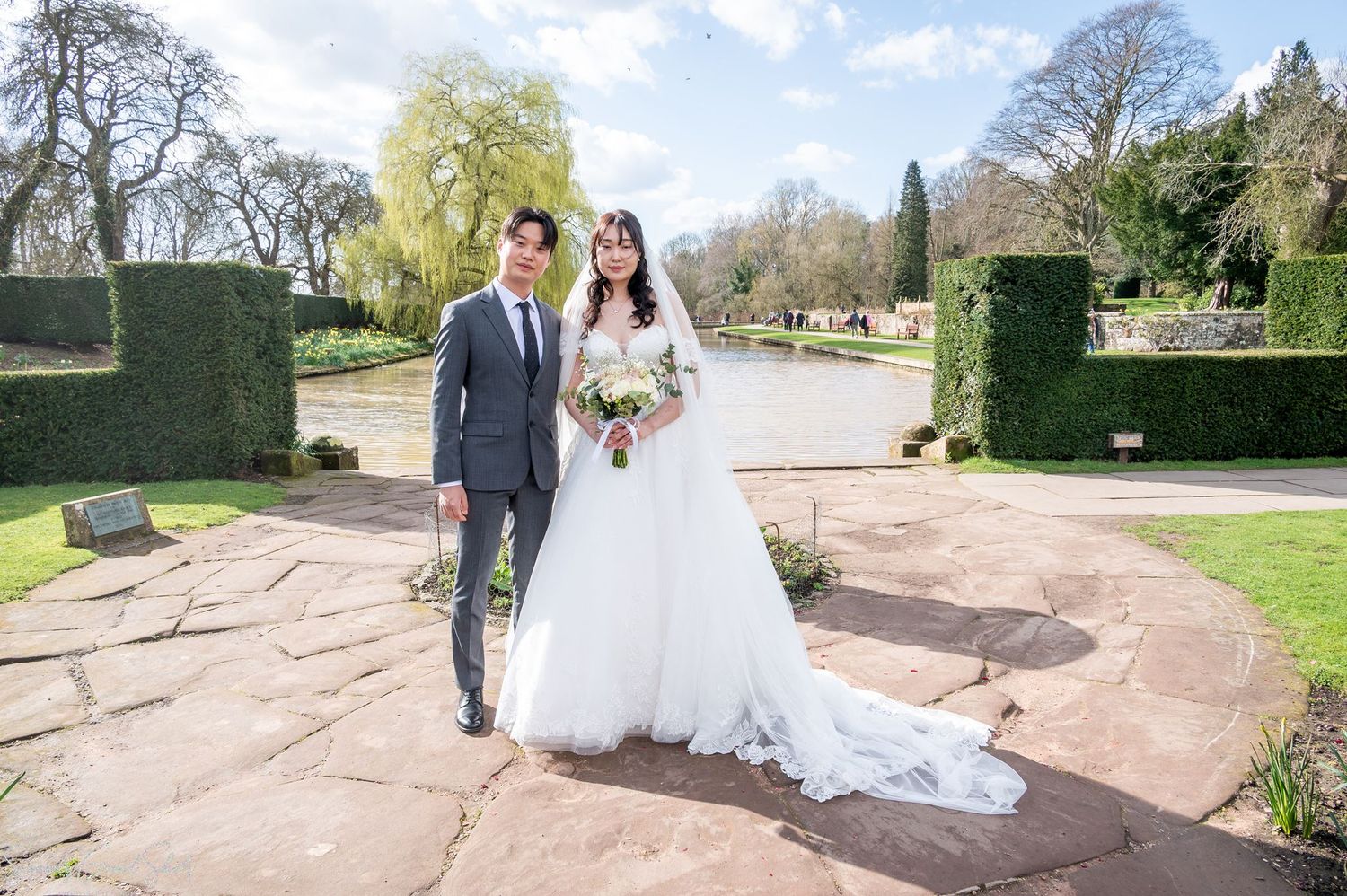 Coombe Abbey wedding photographer capturing bride Minky and her brother by the lake.