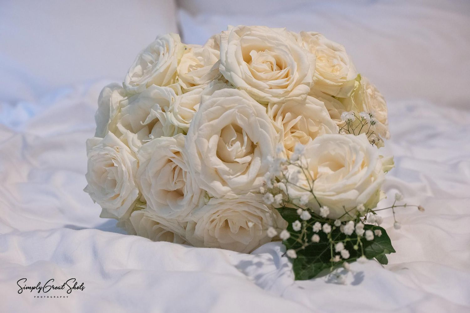 Coombe Abbey wedding photographer captures a beautiful brides bouquet with white roses.