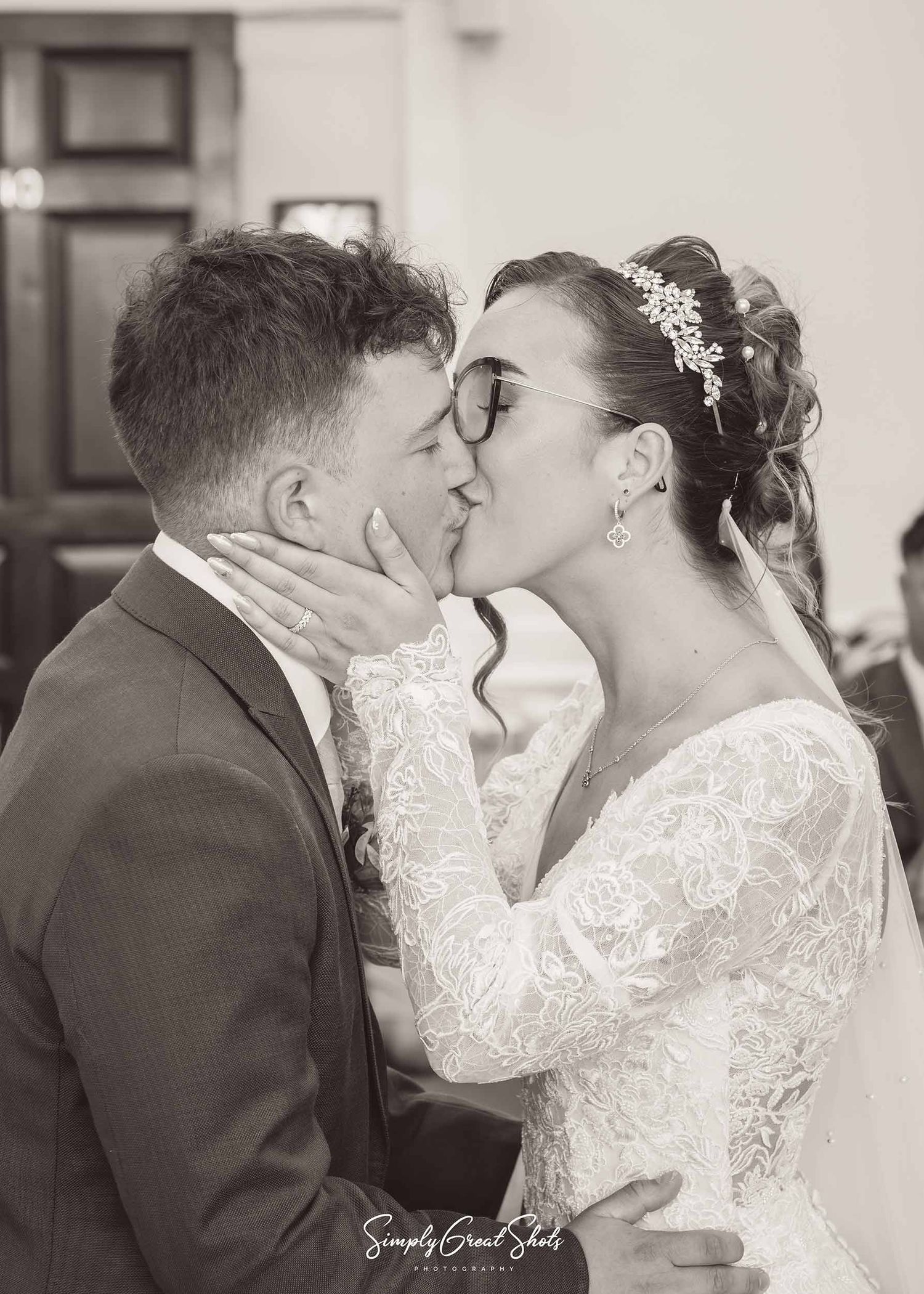 Beaumont Hall wedding photographer captures an intimate kiss between the bride and groom after getting married in The Railton room.