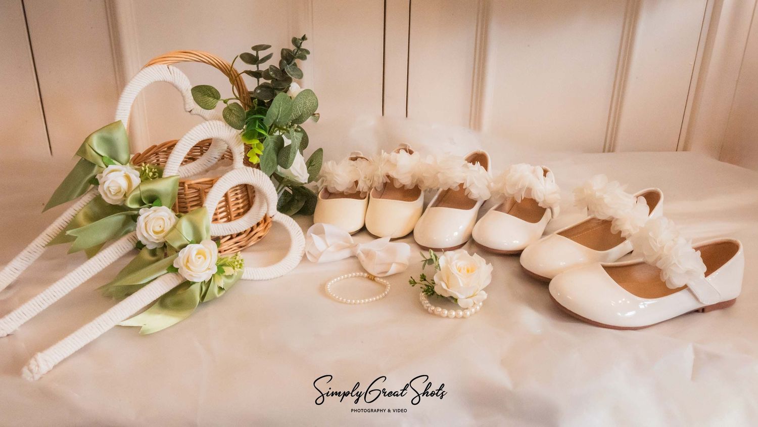 White bridesmaids' shoes, jewellery and flower hoops arranged as wedding details at Rothley Court.