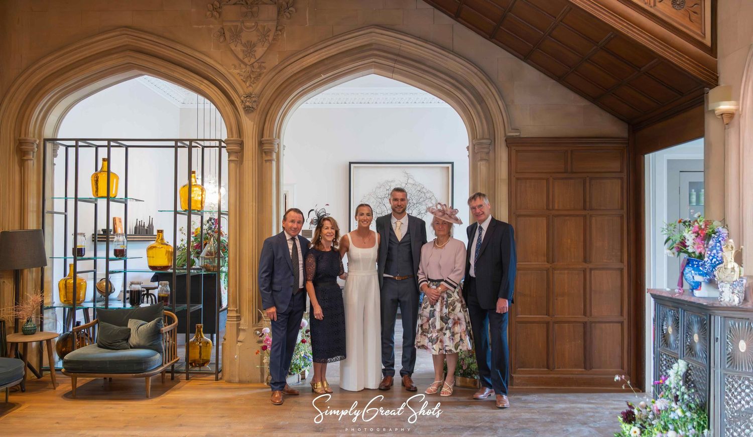 Hampton Manor wedding photographer captures a wedding couple portrait within grand interior spaces