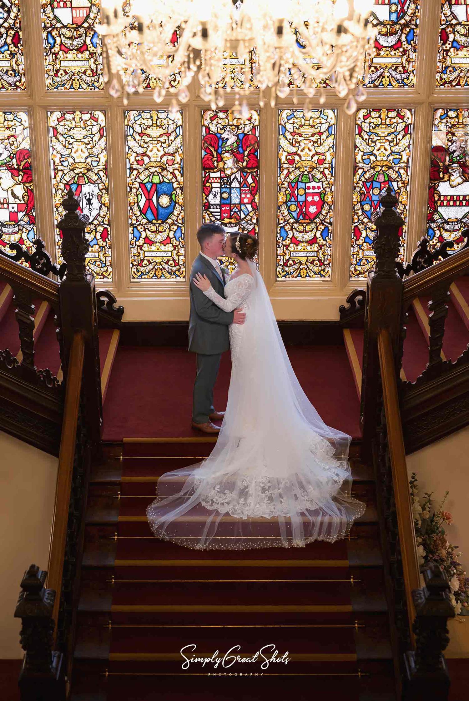 Beaumanor Hall Wedding Photograph captures a husband and his wife sharing a passionate kiss to celebrate getting married.