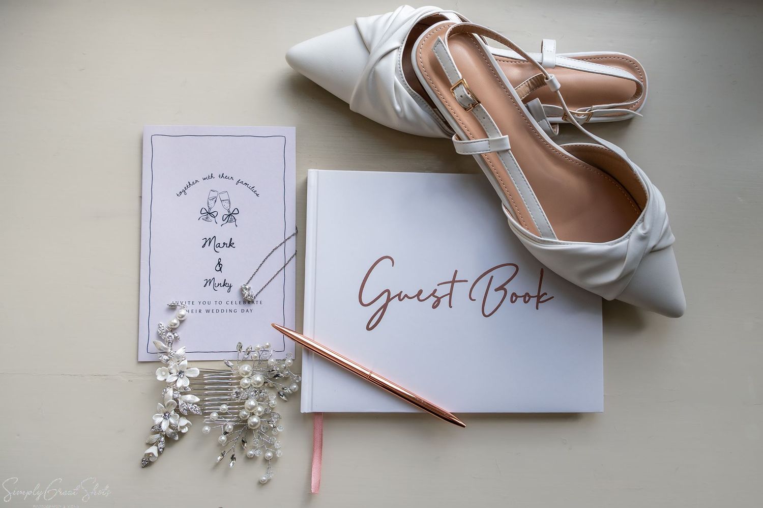 Flat lay wedding photography of bridal slingback shoes, invitation, and accessories at Coombe Abbey.