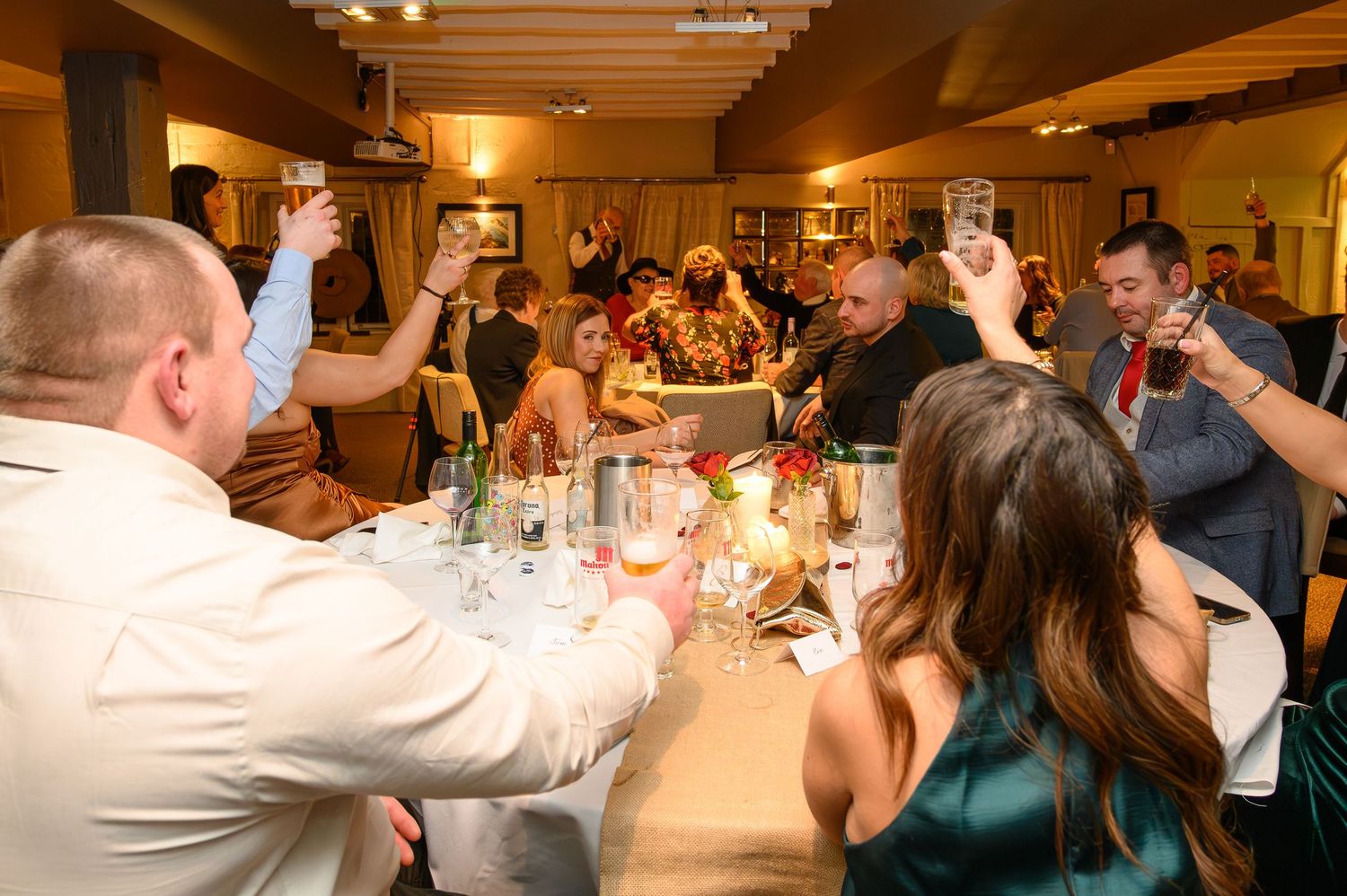 Wedding guests raising a toast during the speeches at the Saxon Mill in Warwickshire – SimplyGreatShots Photography