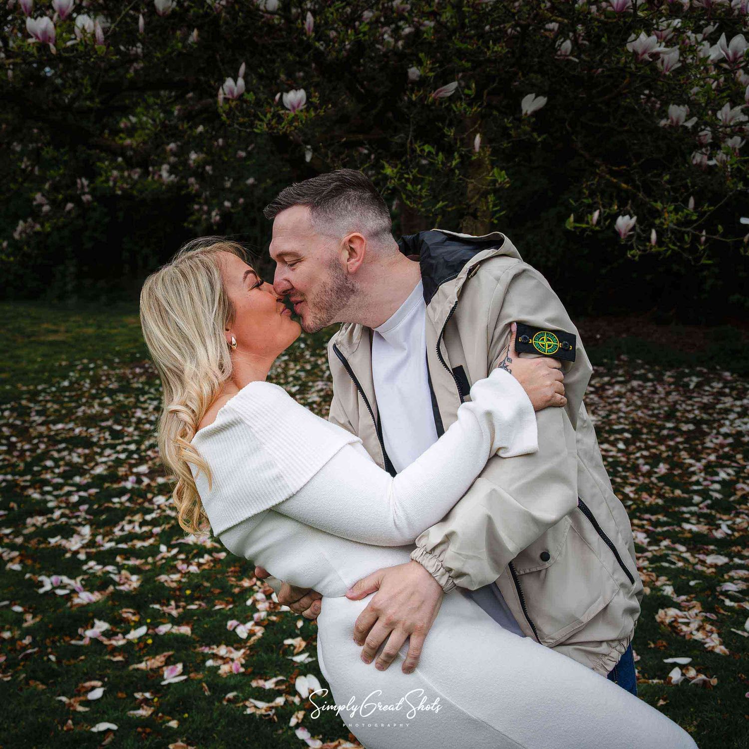 Rothley Court wedding photographer captures a couple kissing whilst performing a throw-back pose on their pre-wedding photoshoot.