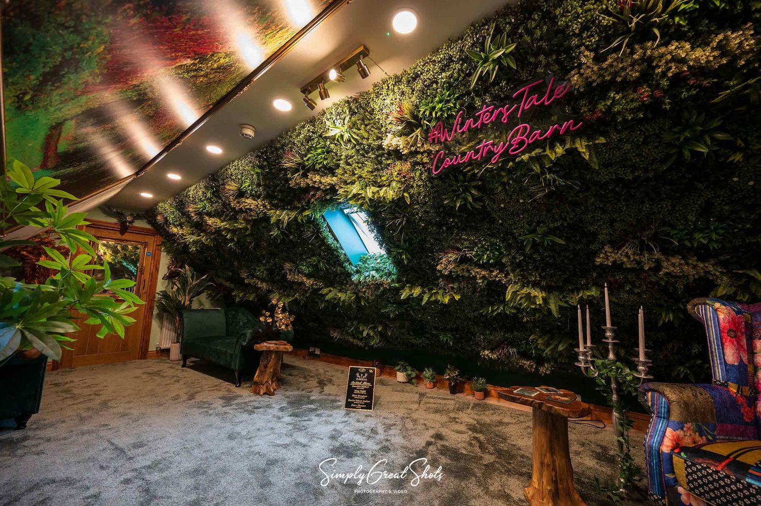 Winters Take Country Barn wedding photographer captures the private relaxation room with chaise lounge's plush carpets and green foliage.