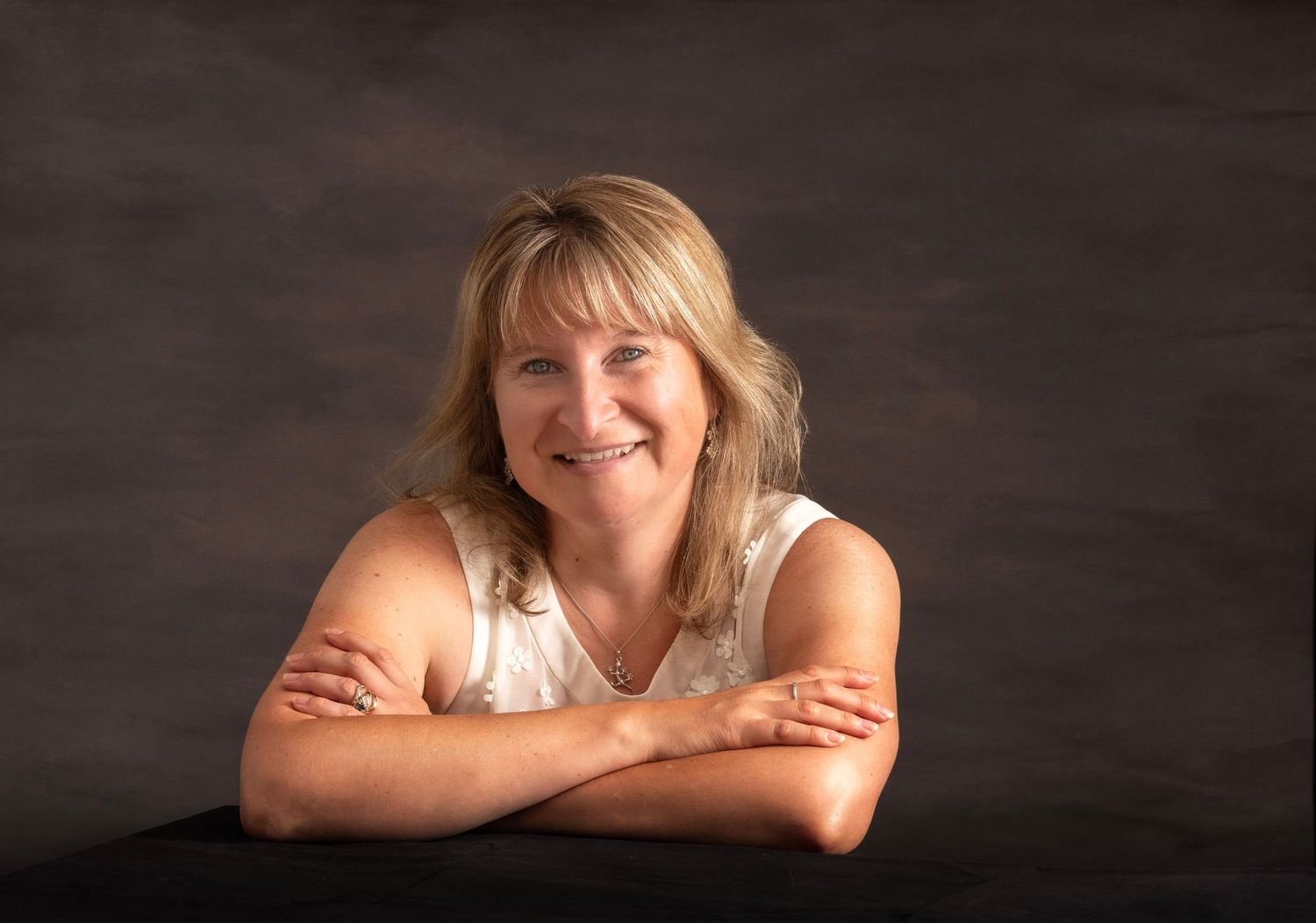 A business ladyt posing for a headshot phoptograph