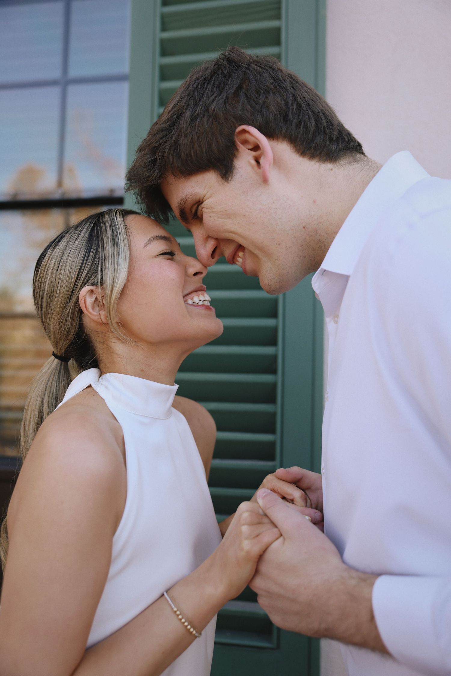 houstonian bride and groom to be embracing in an outdoor setting
