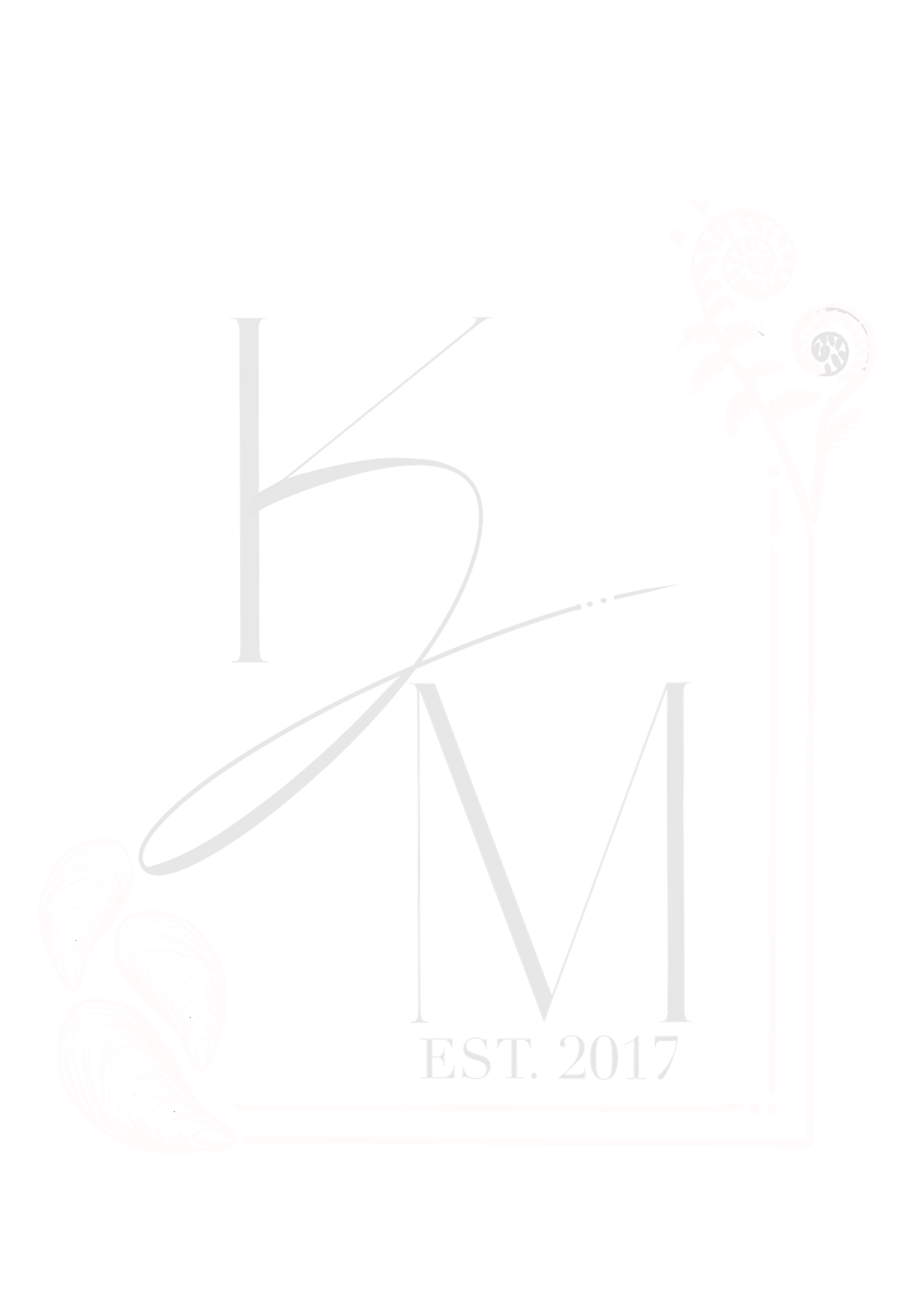 Elegant KM monogram logo with EST 2017 text in soft white tones featuring decorative script lettering.