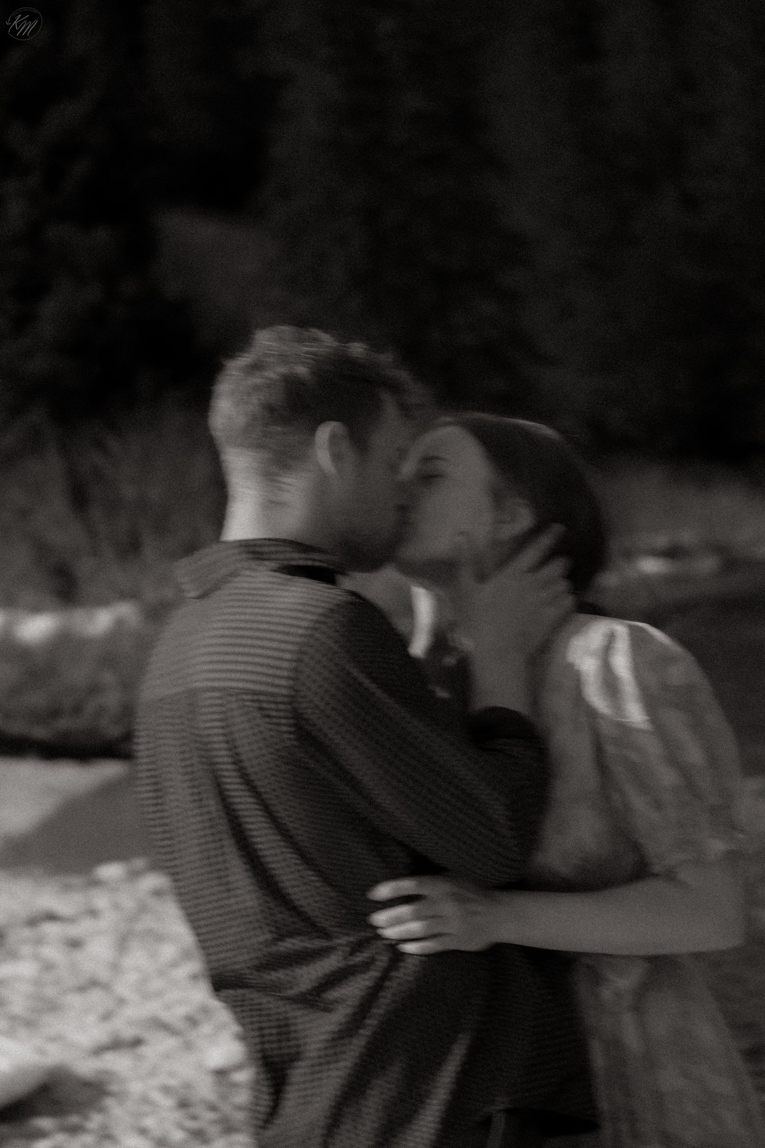 Intimate black and white sequence showing couple's tender embrace.