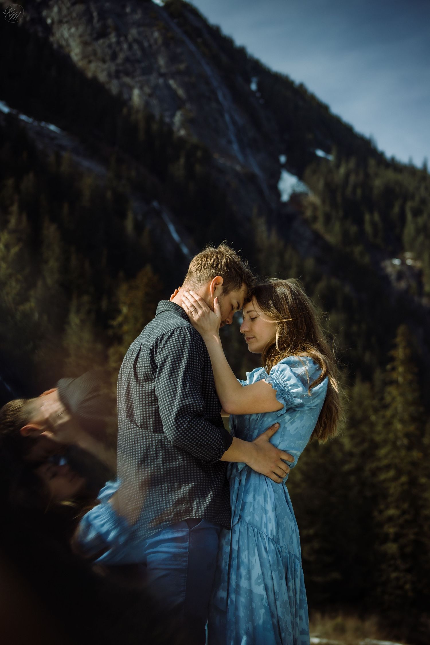 Romantic mountain photoshoot sequence with couple in coordinated casual outfits.
