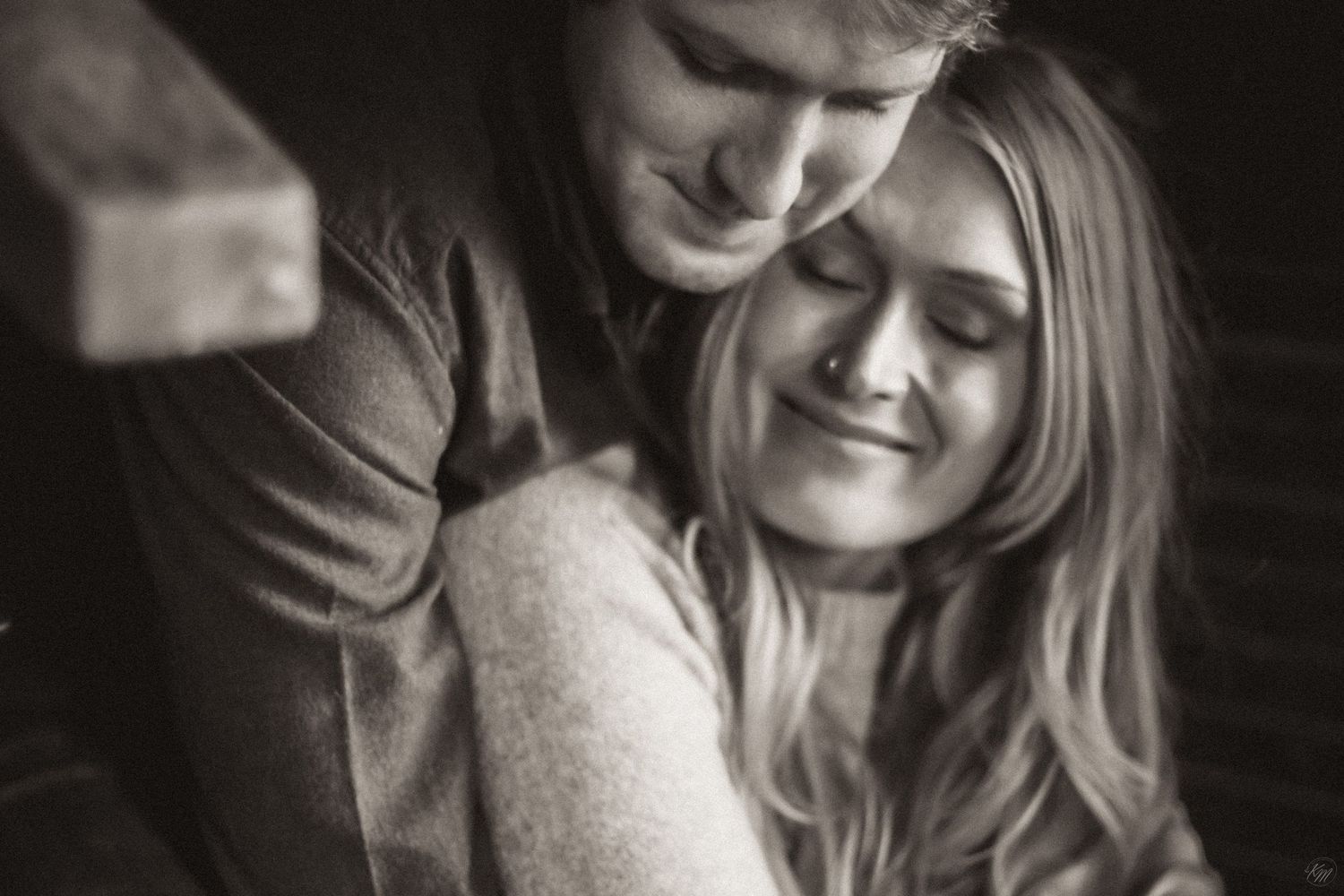 A tender black and white portrait of a couple sharing an intimate moment together in Southeast Alaska