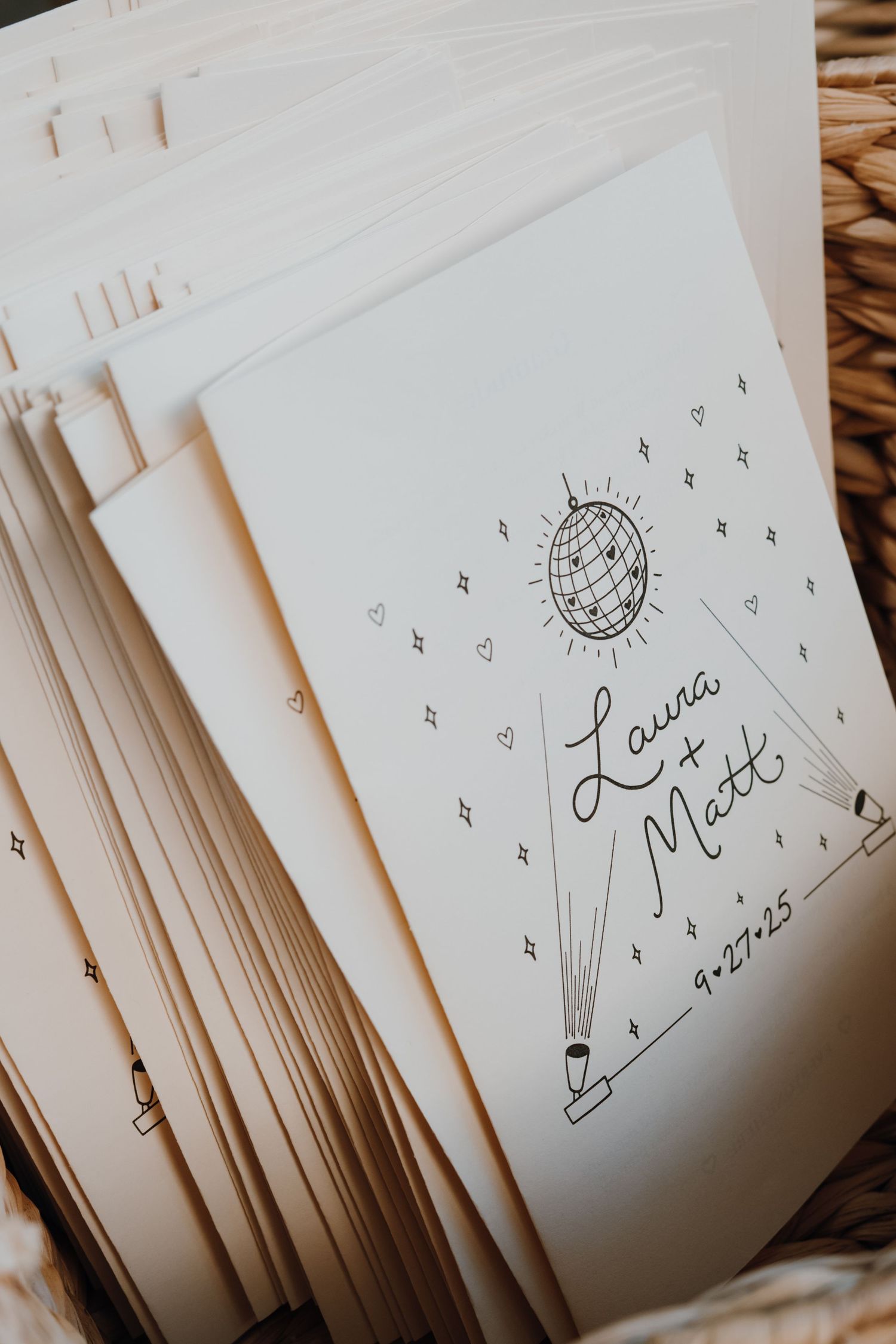 Wedding programs featuring hand-drawn disco ball design for Laura and Matt dated 9.27.25.