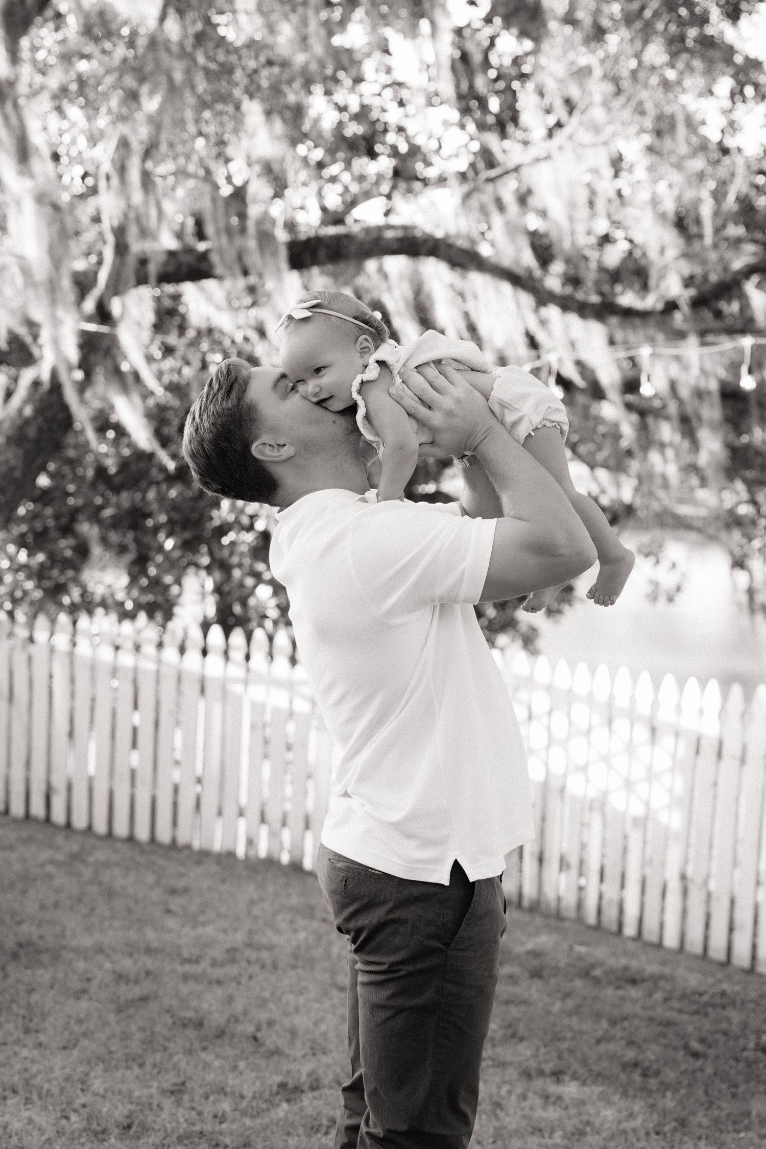 Three sequential black and white photos show a person in a white shirt drinking from a bottle in a backyard setting.