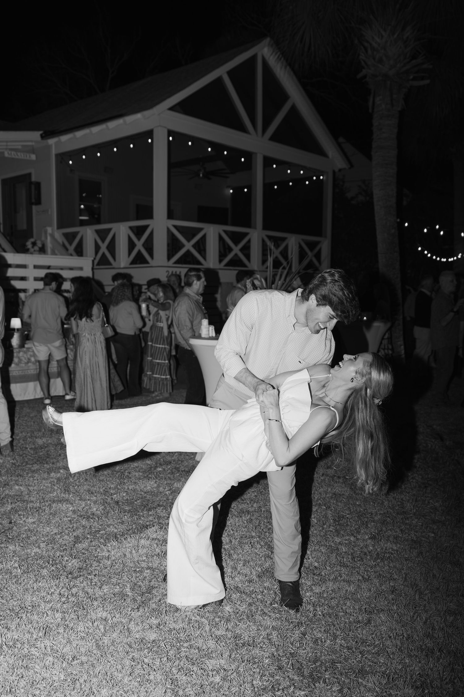 Black and white photos show couples dancing at an outdoor evening reception with dramatic dips and spins.