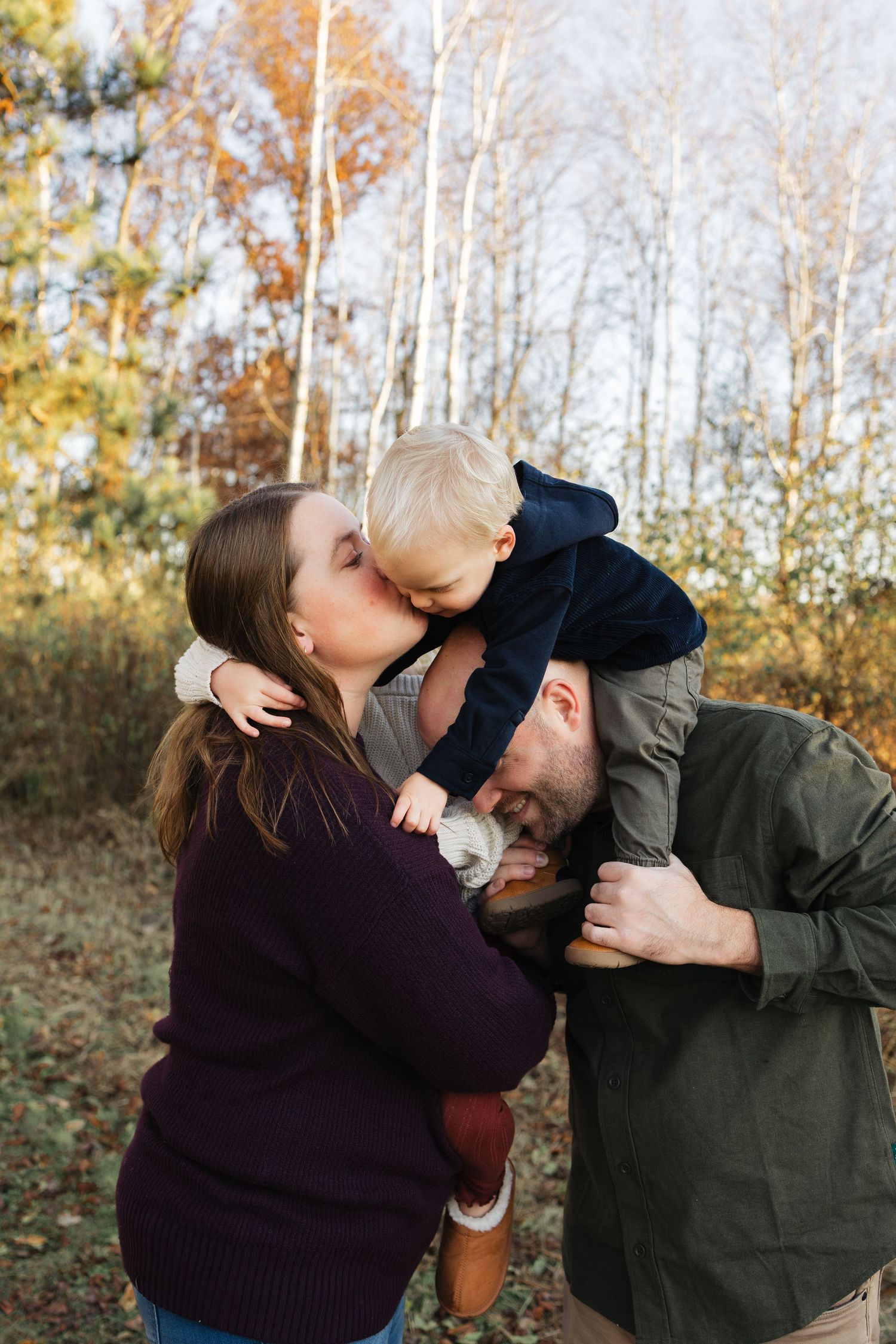 A playful sequence of candid moments between people in an autumn woodland setting.