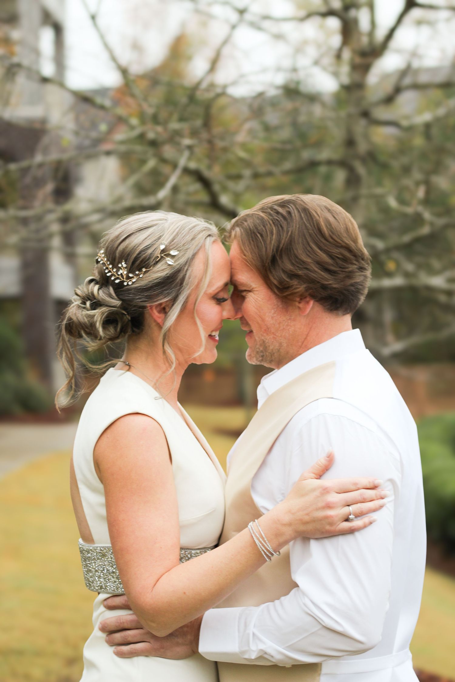 Intimate wedding portrait showing tender moment between newlyweds.