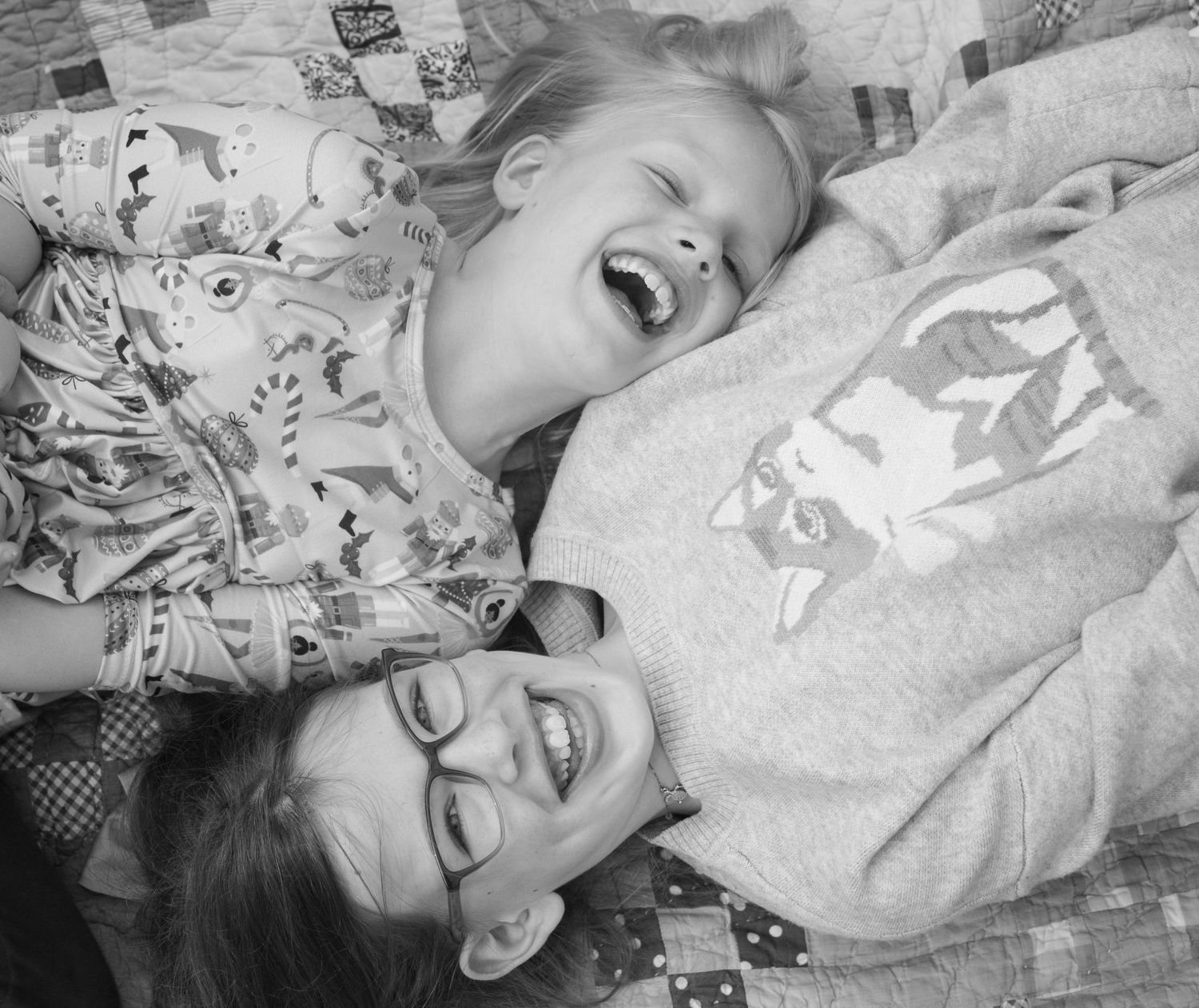 Black and white candid photos showing joyful laughter and genuine expressions.